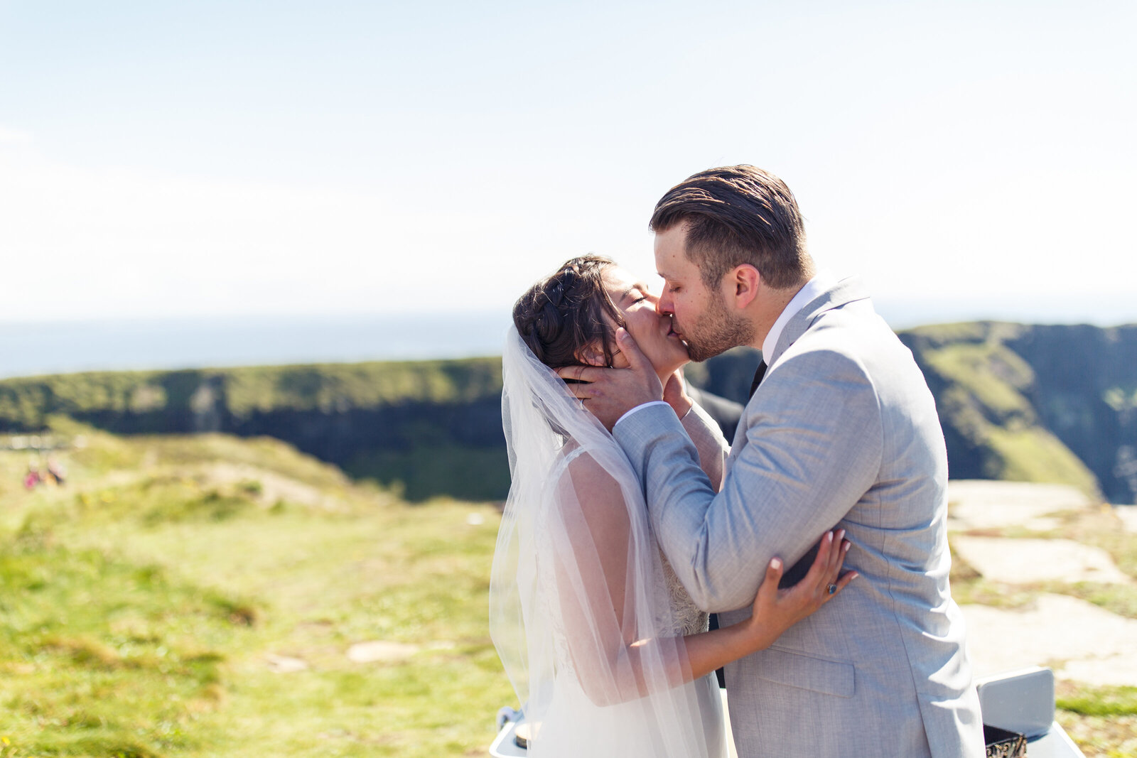elopement first kiss at hags head on the cliffs of moher