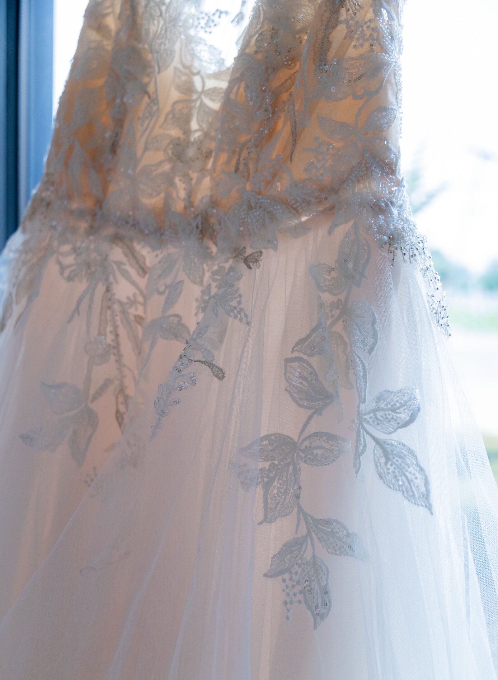 close up of wedding dress lace applique