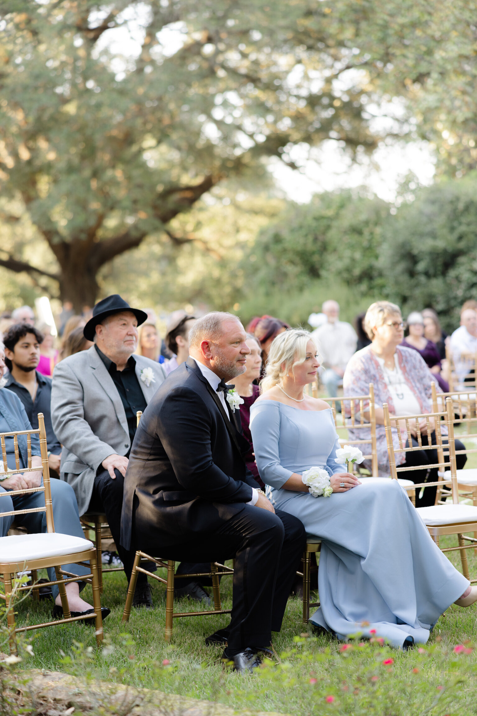 Wedding guest enjoying the moments before the ceremony at UL Alumni Center, captured on film by Morgan Alysse, Louisiana film photographer.