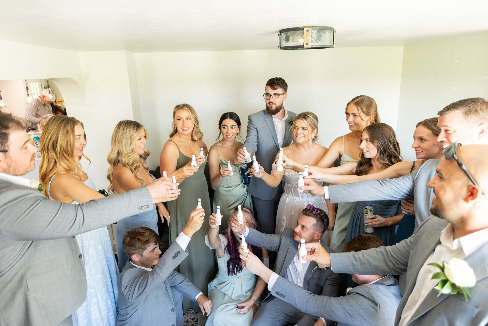 Bridal Party doing shots together before the wedding