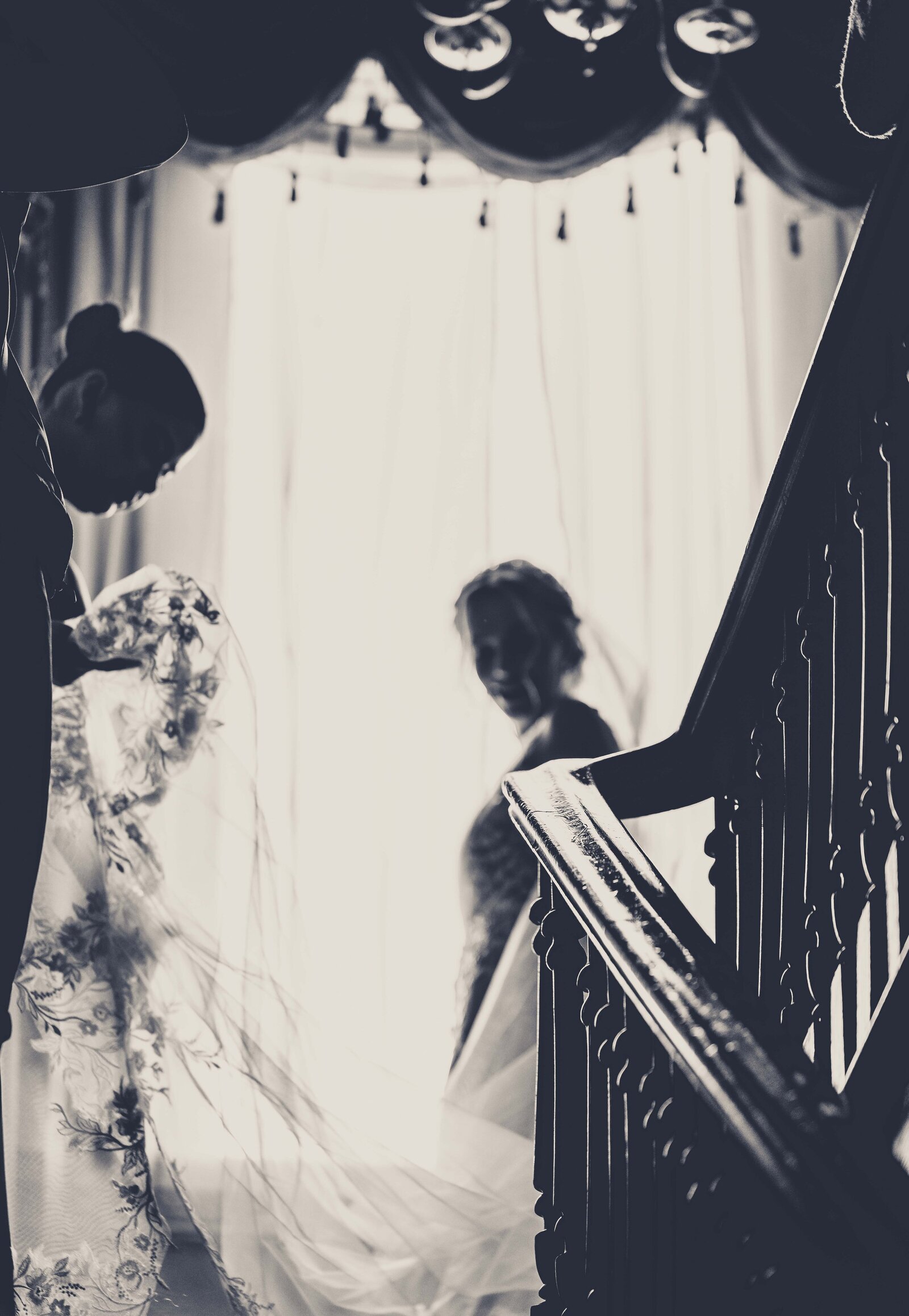 Step into the intimate and graceful moments of a bride putting on her dress at The Bell. This stunning photo captures the anticipation and beauty of her wedding day preparation, showcasing exquisite details of her gown in a charming setting. Explore our gallery for more inspiring bridal dressing moments and timeless wedding day photography.