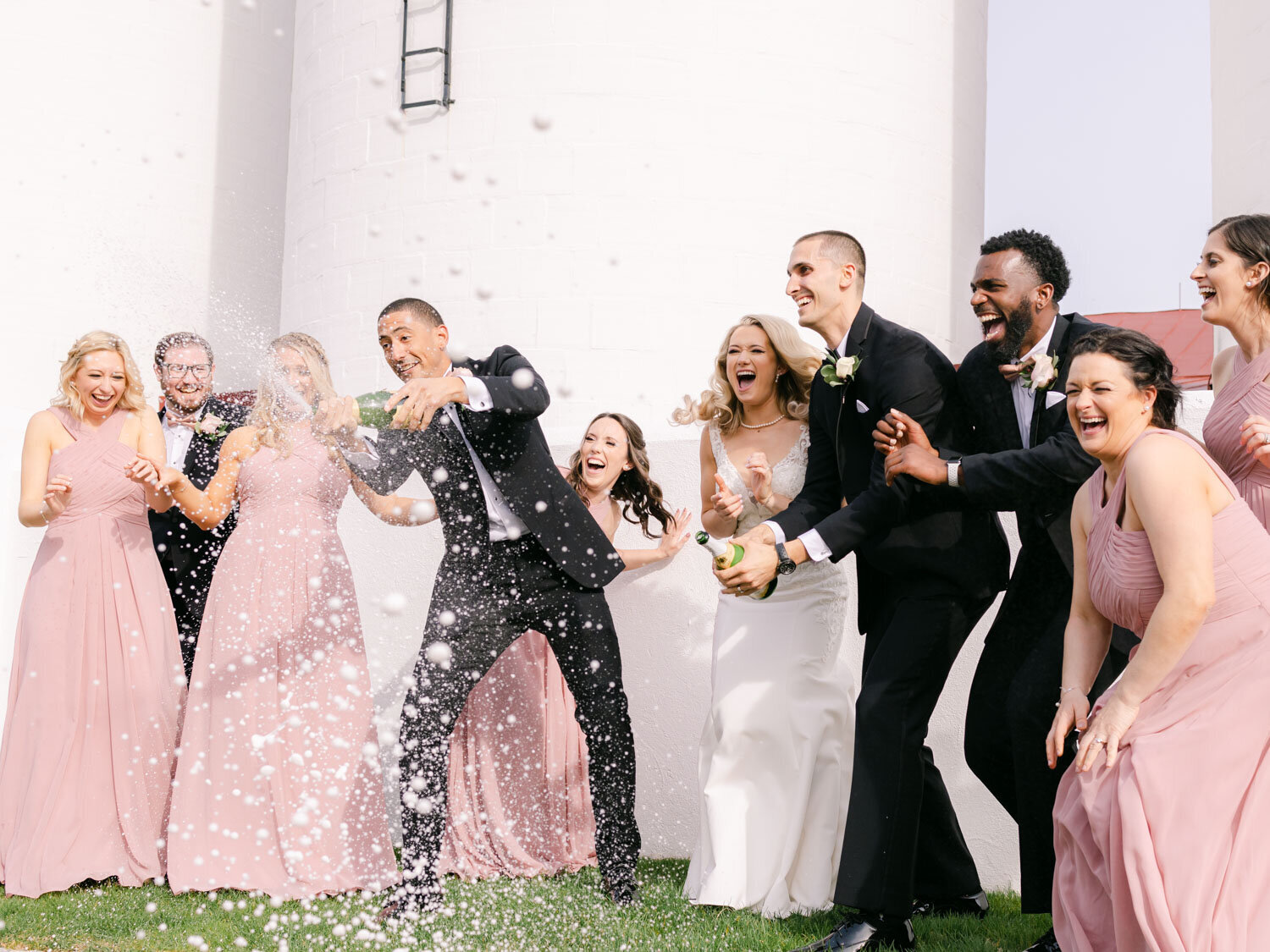 Spring Wedding Party Popping Champagne