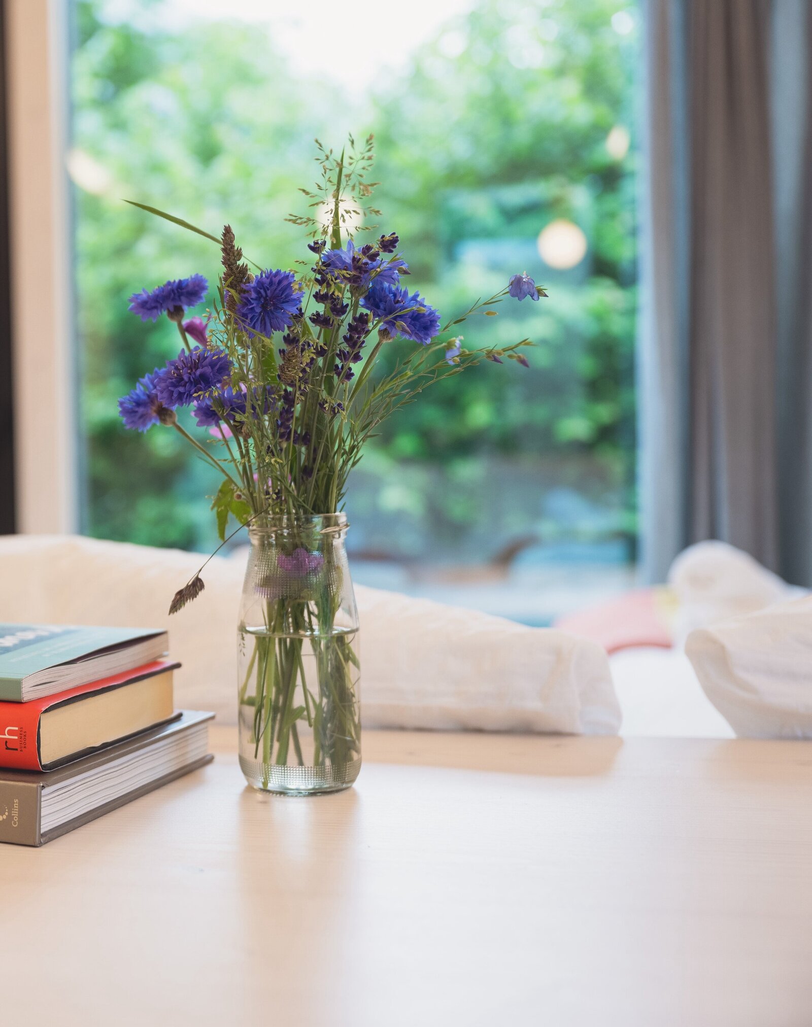 Shot of cut wildflowers inside a Tiny Home at The Campus Alps.com, adding a touch of nature and tranquility to your stay during private getaways or company retreats in the Alps.