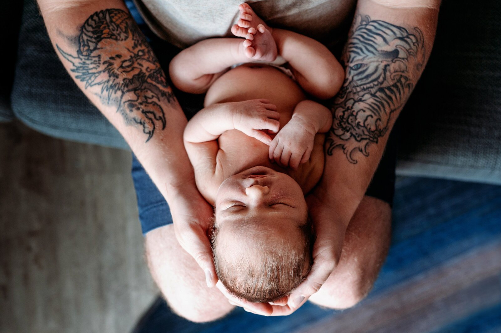 Newborn in dad's arms