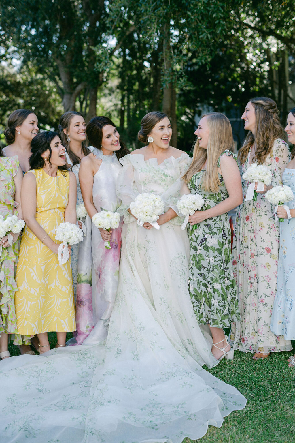 bride with bridesmaids in floral pattern dresses for a beach wedding in Florida