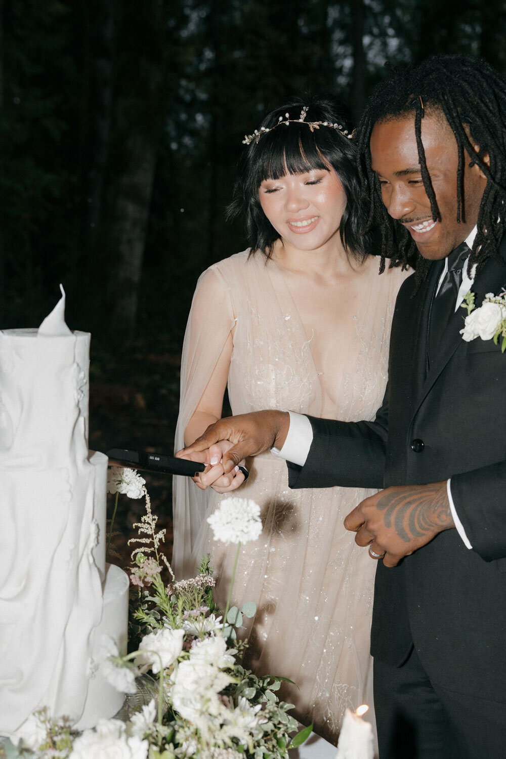 Bride and groom cutting their wedding cake