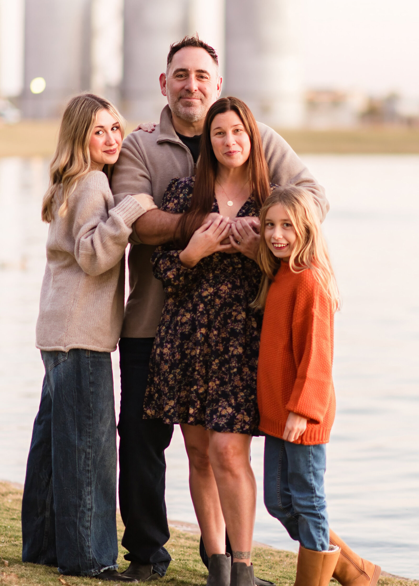 family of 4 posing for family photos in gilbert az