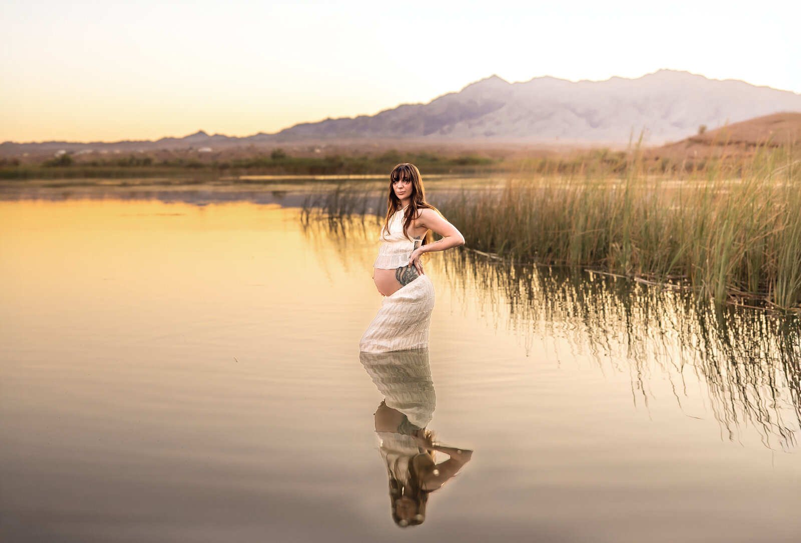 maternity un the water at golden hour 