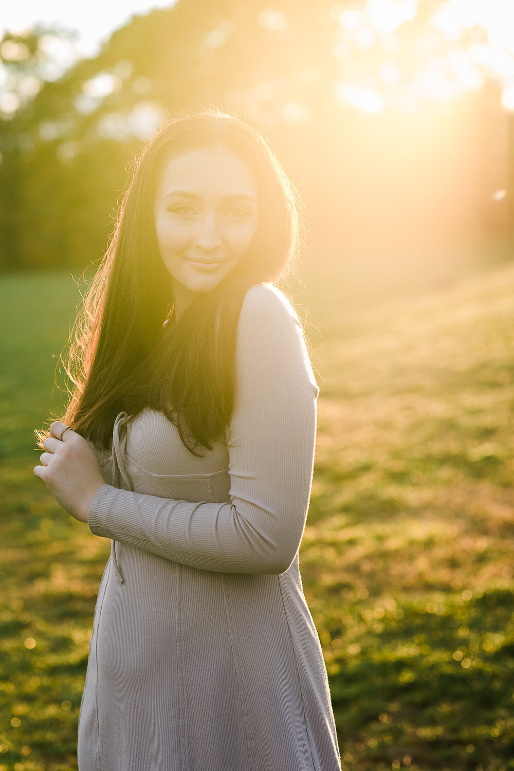 senior girl in park at sunset