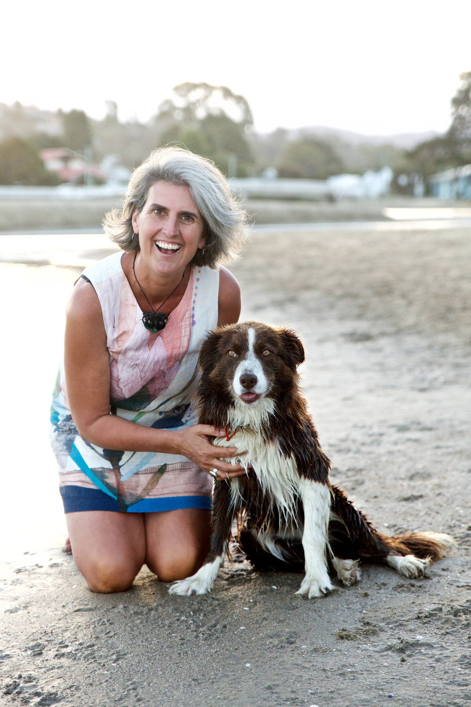 Chelsea Loren branding photographer San Diego California Orange County woman on beach with dog