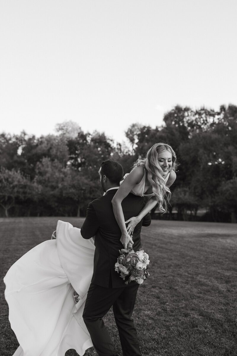 Goom holding bride taken by washington adventure elopement photographer