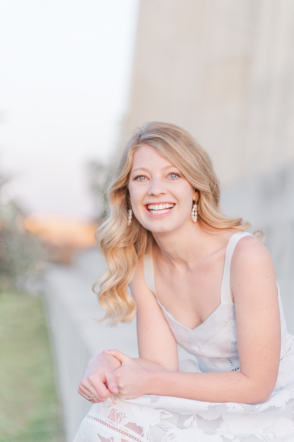 college senior with a big smile at Lincoln Memorial