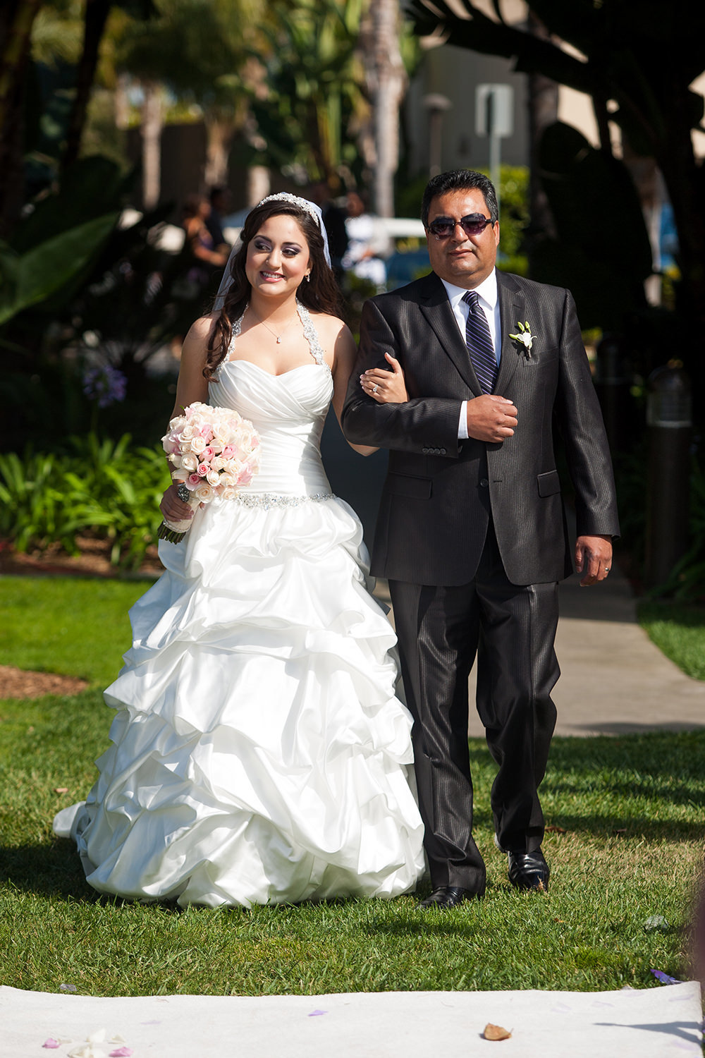 bride walking down the aisle at the dana