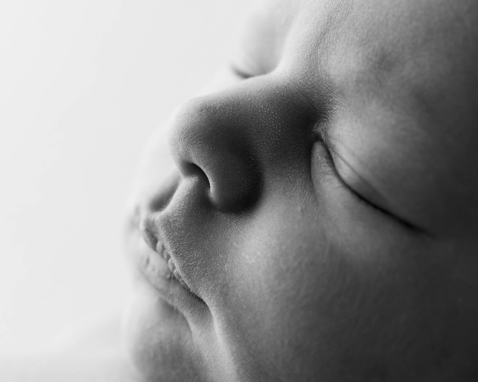 Black and white close-up picture of newborn face