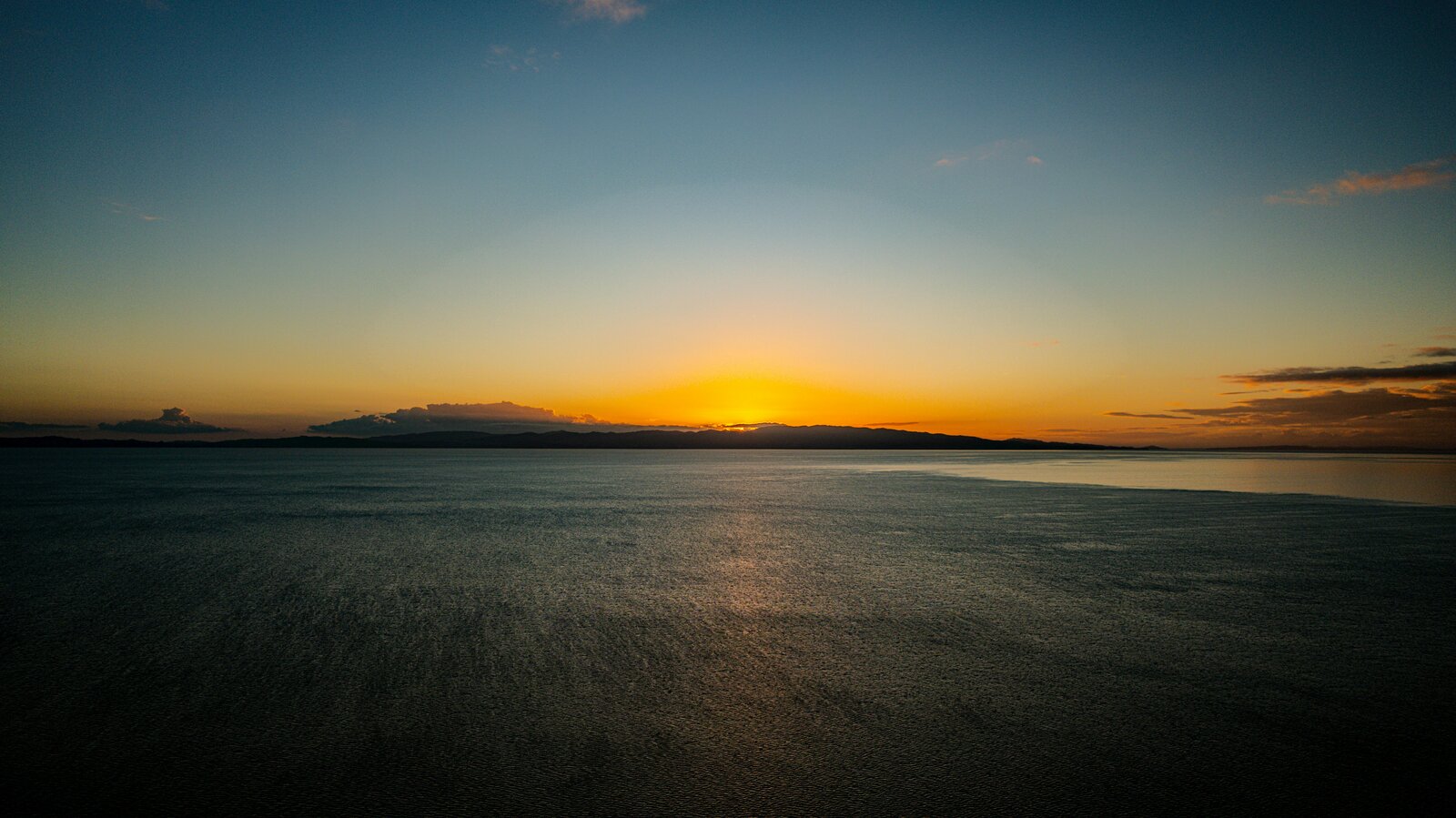 Tranquil ocean at sunset representing peace, reflection, and emotional release
