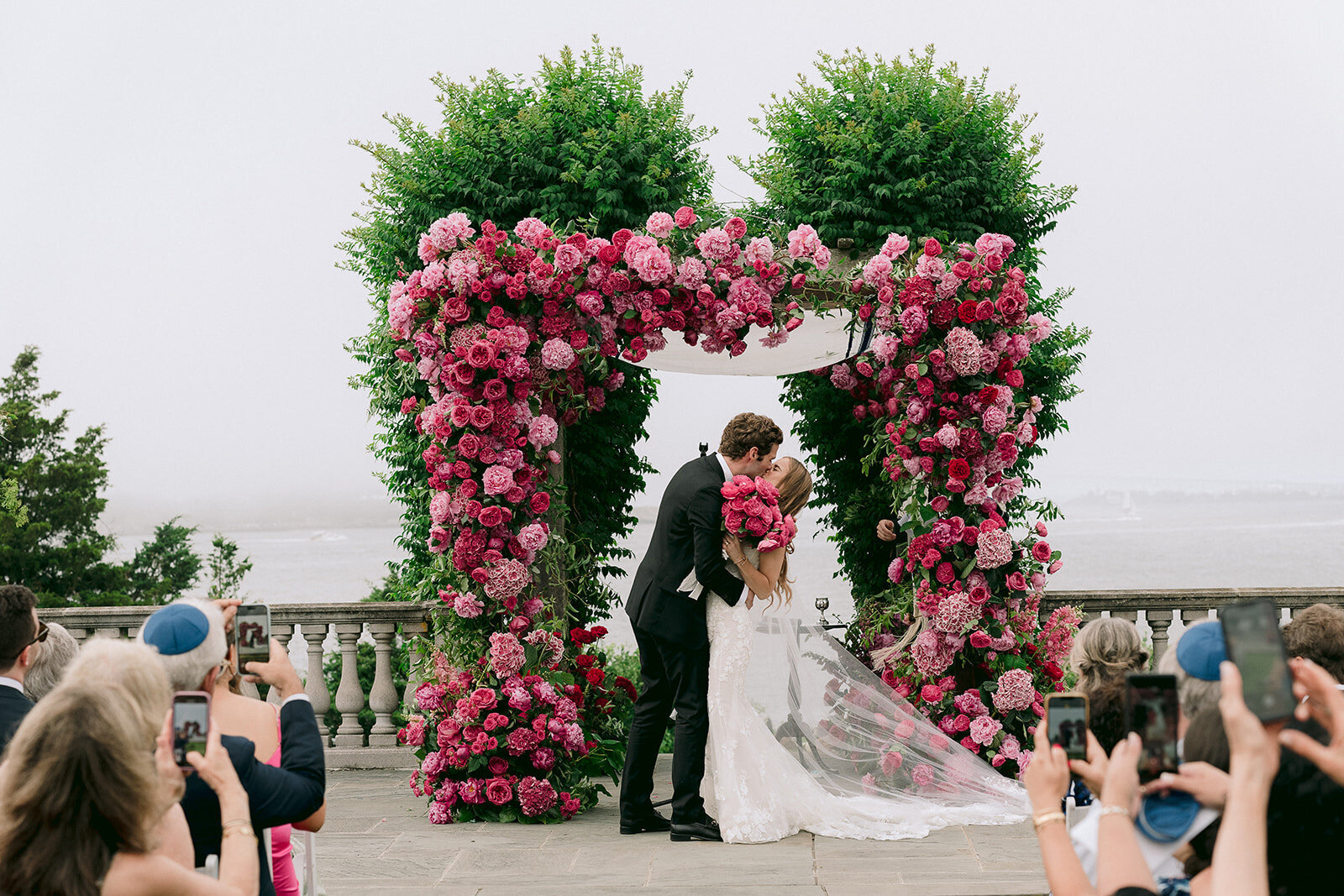 Bride and Groom Share a Kiss at Castle Hill In - Eventlightenment Wedding Planning
