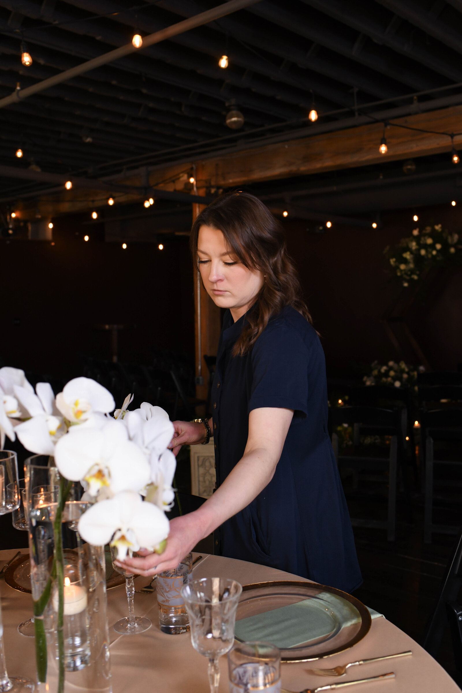 Kelsey arranging orchids