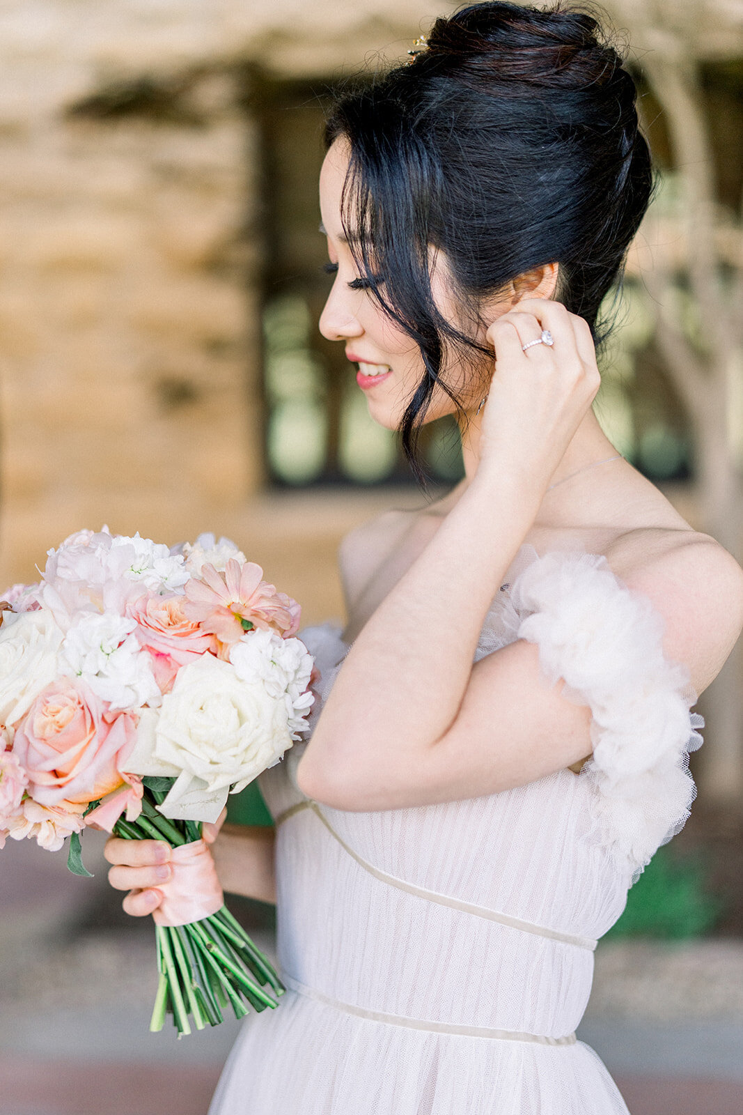 A stunning bride in her wedding gown, savoring a quiet, blissful moment at the beautiful Filoli estate in Woodside, California.
