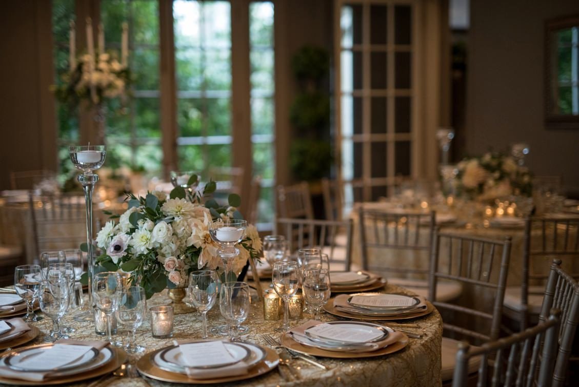 Classic wedding tablescape and placesetting in gold, champagne, silver, white and blush at Lord Thompson Manor, CT