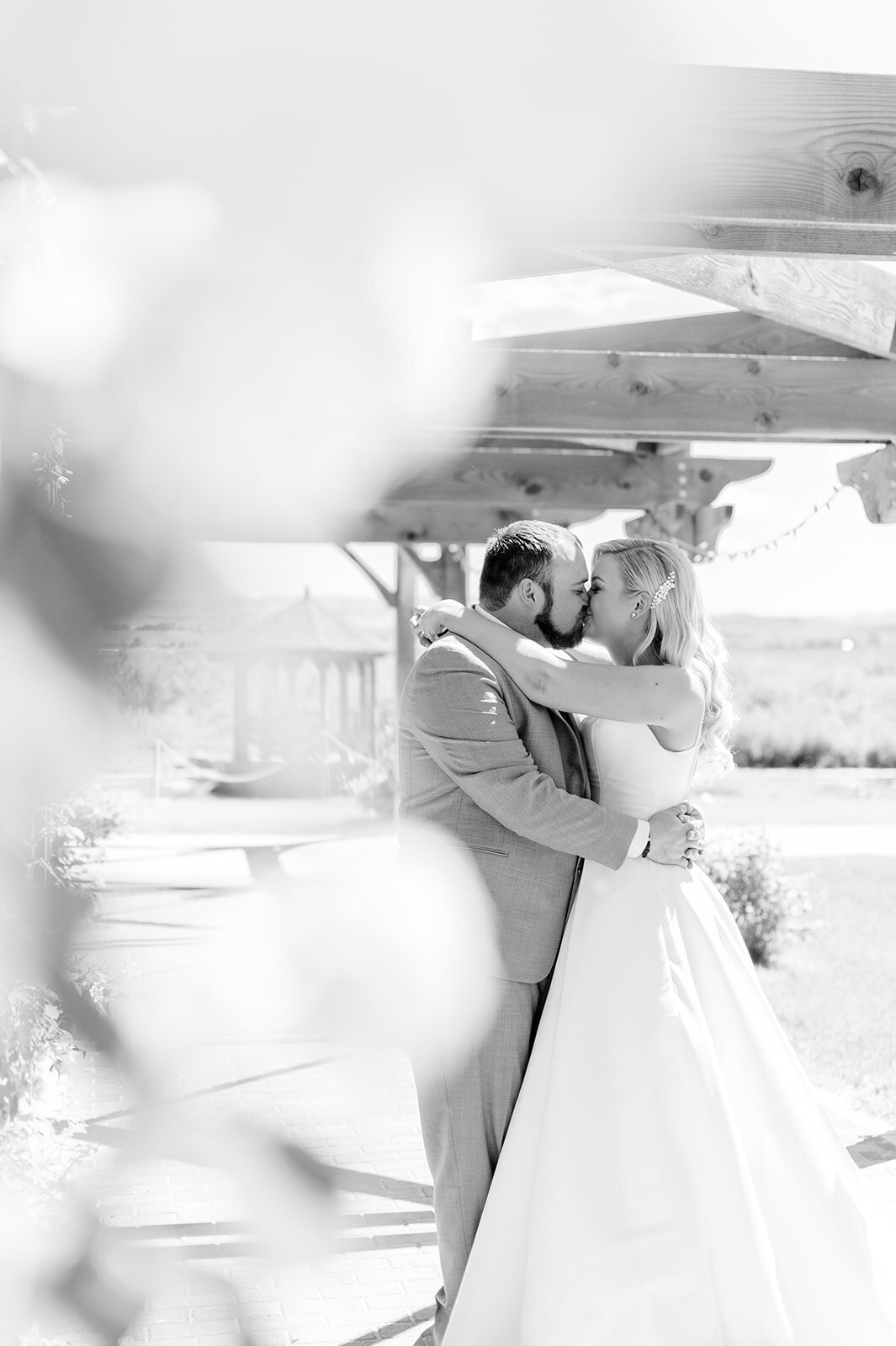 Black and white wedding photo of bride and groom taken by the Best Boise Wedding Photographers