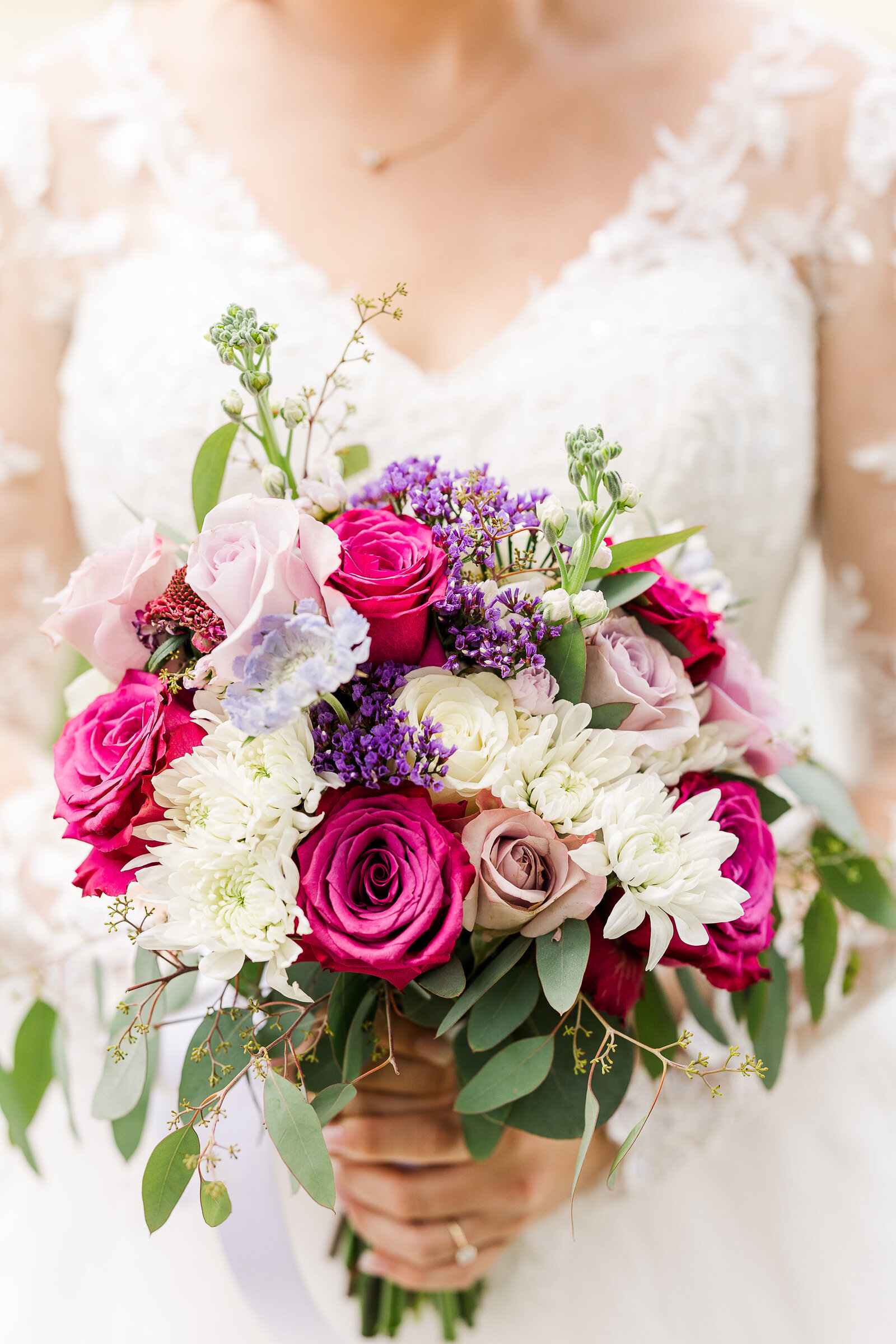 Up close detail image of bride holding her fully beautiful bouquet
