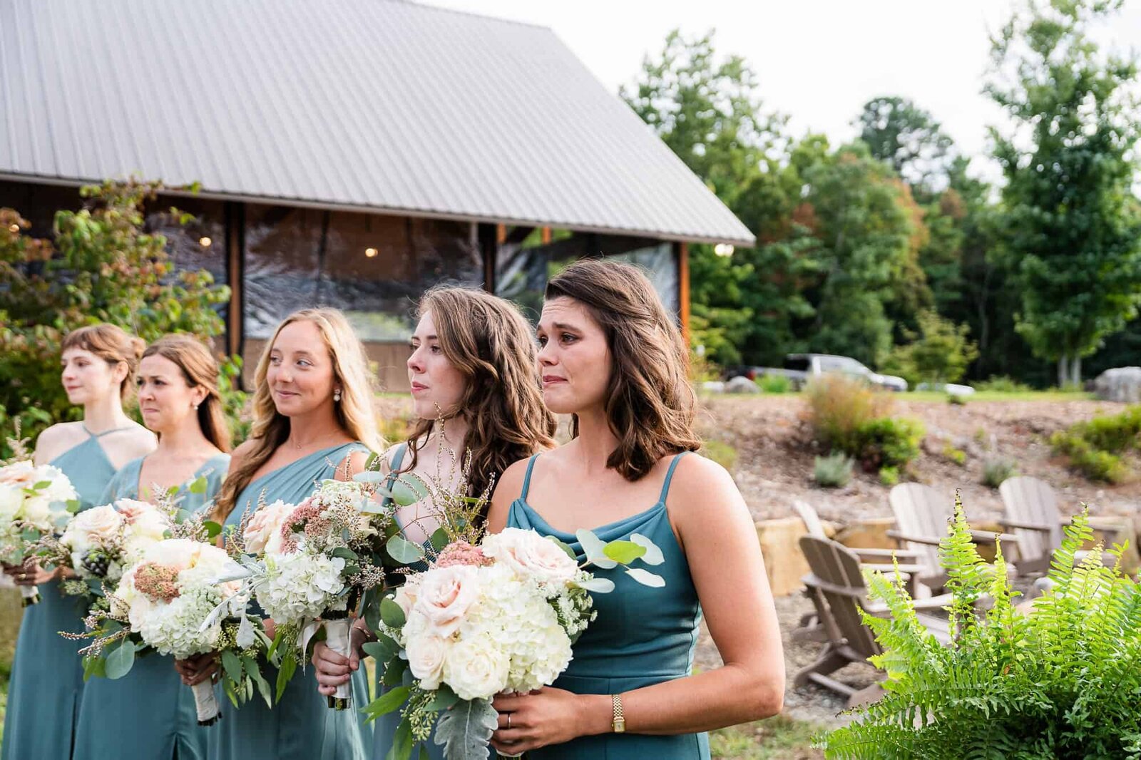 Allie's sister, the maid of honor, crying, watching Allie and her father walk down the aisle at terra incognita vineyard wedding