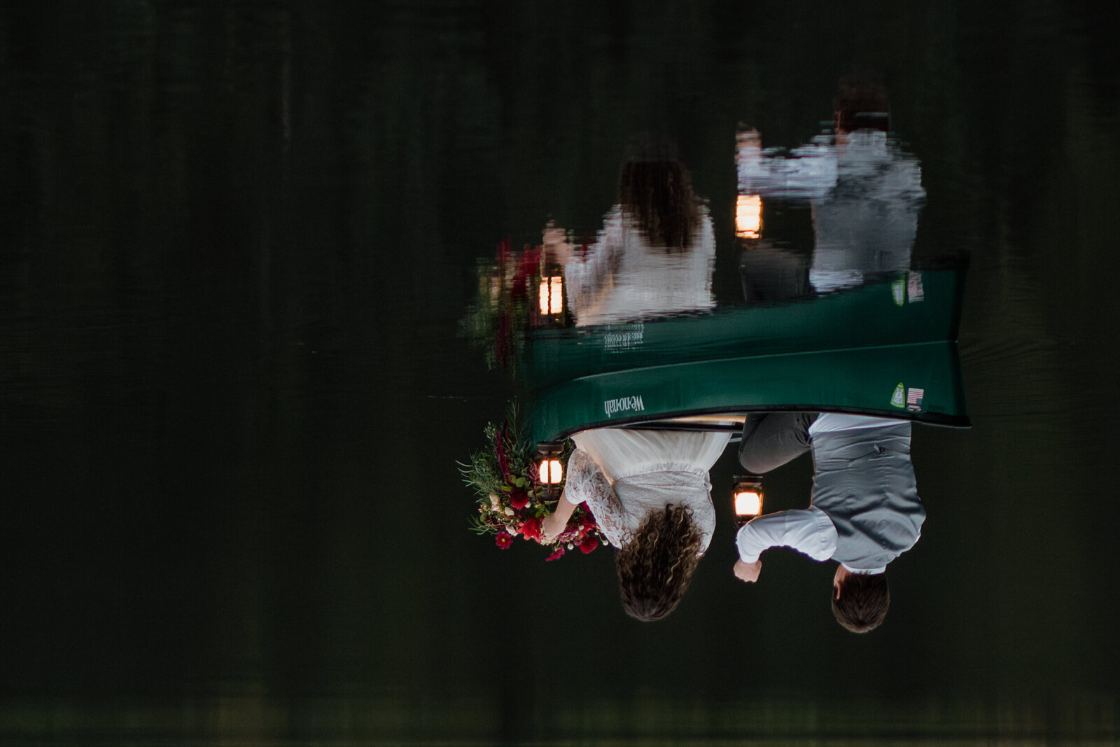 Couple canoeing during their Adventure Elopement at Trillium Lake in Oregon.