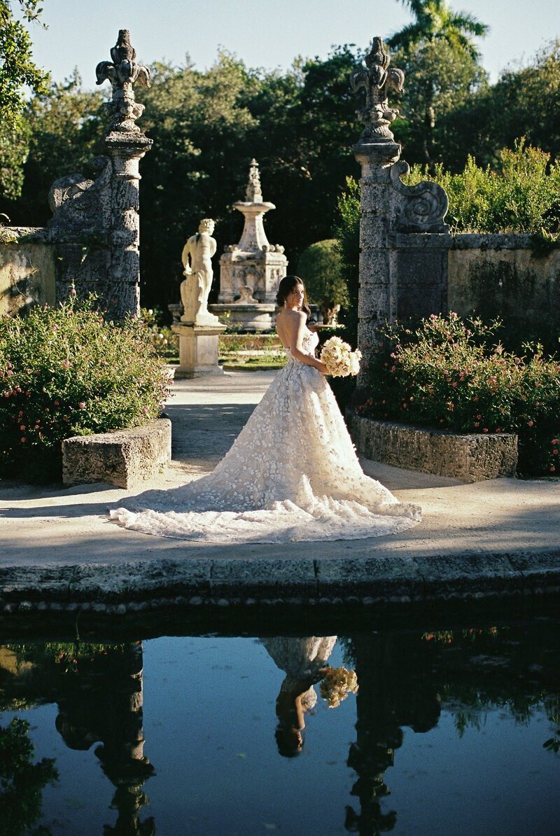 bride holding bouquet in gardens, taken by fort myers florida wedding photographers