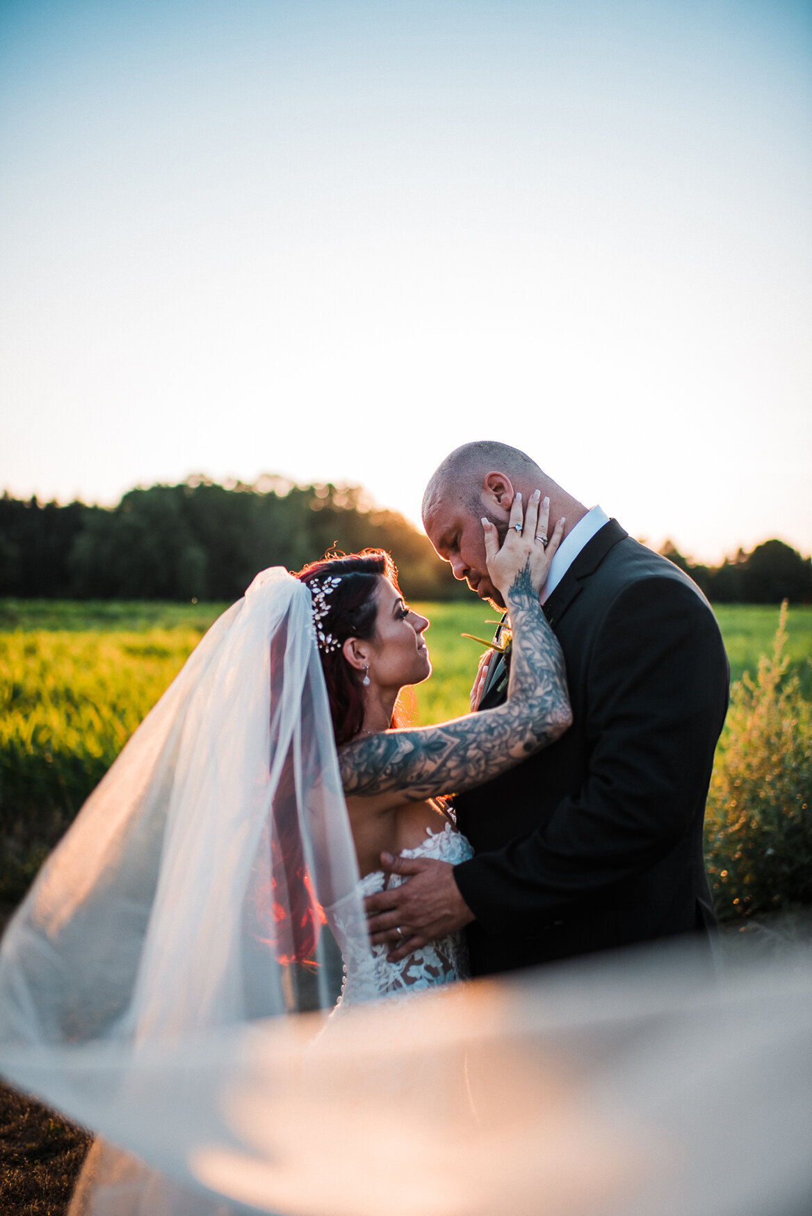 bride and groom in field