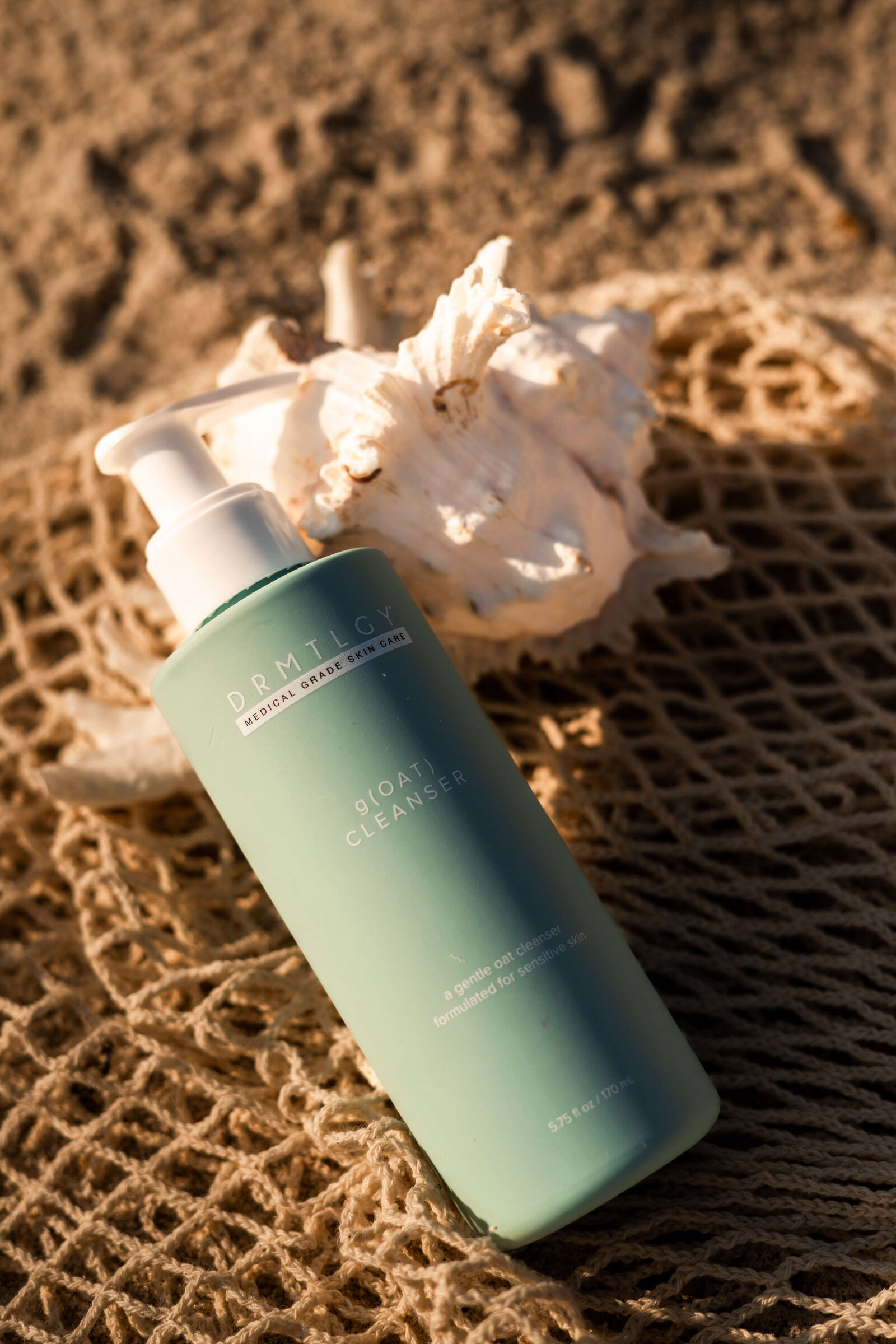 Upclose of skincare product on beach
