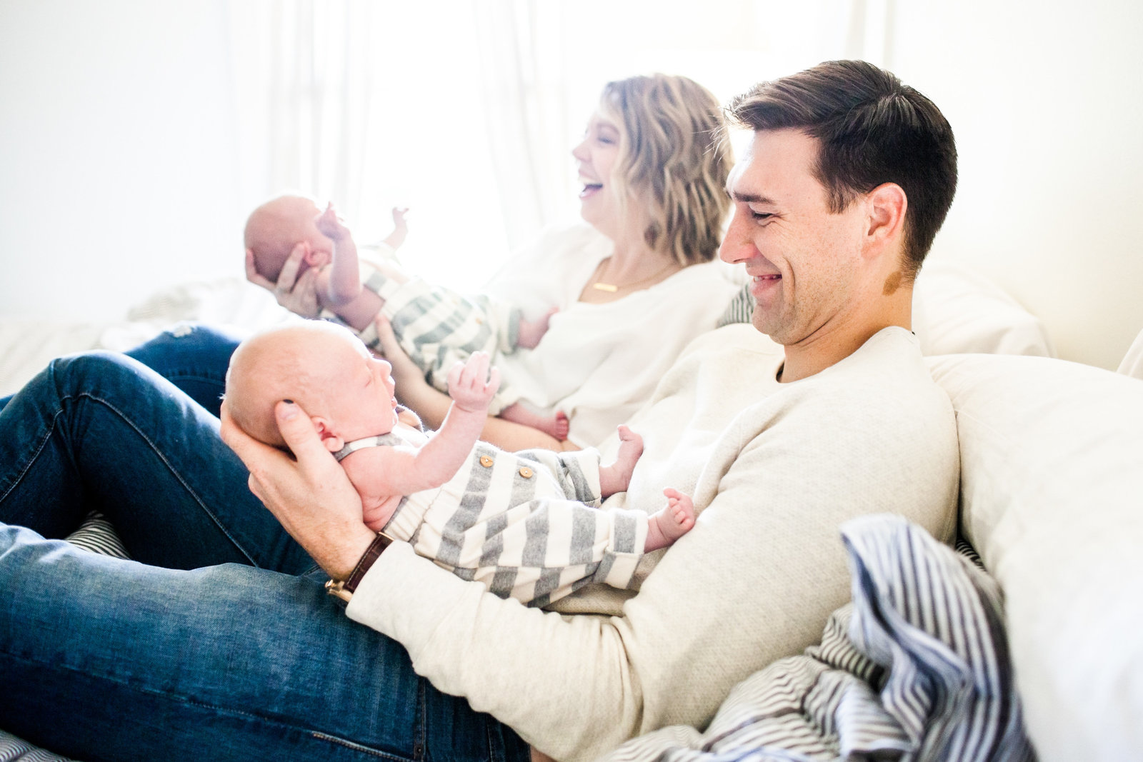 Lifestyle family portraits in home of newborn twins