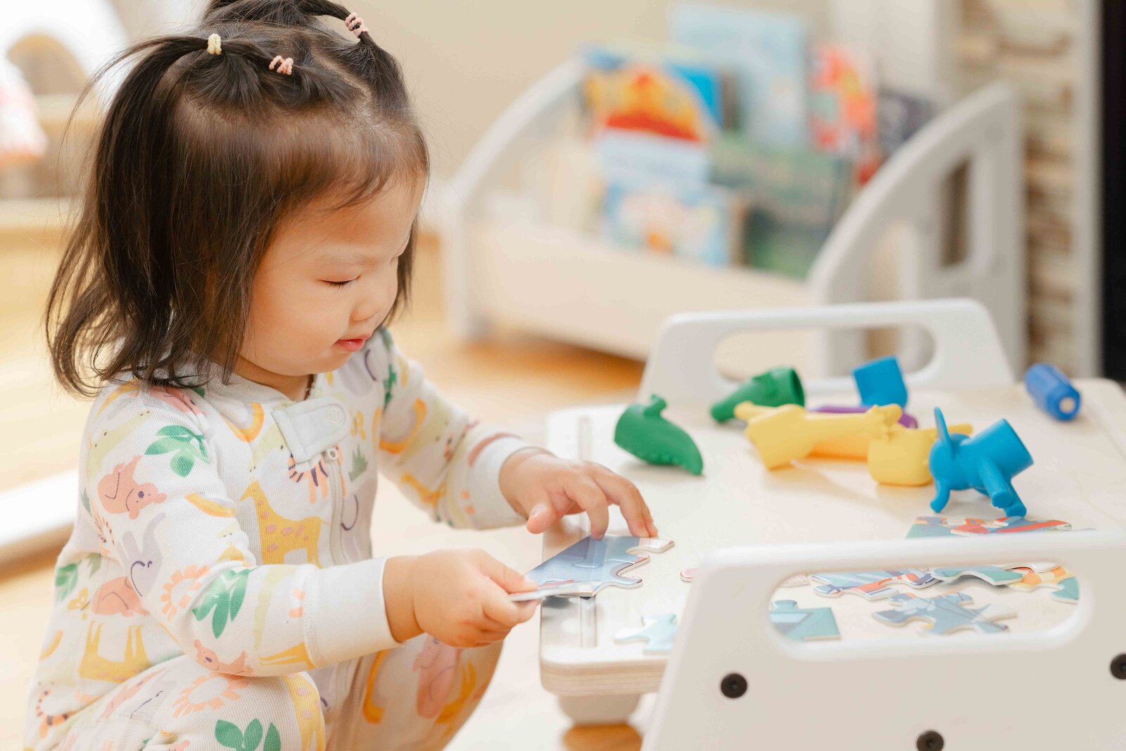 girl playing with toys on activity tray during Vienna,Virginia product photo