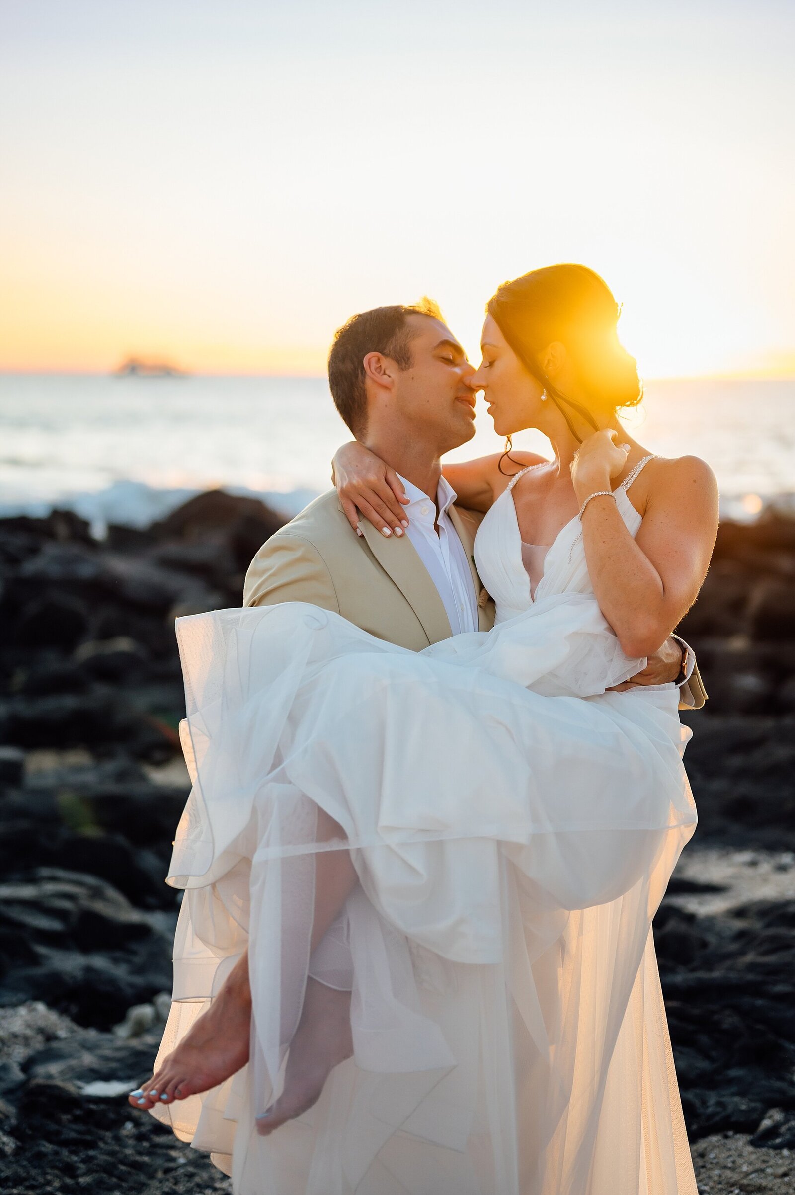 golden sunshine envelope the couple at their beach wedding in Hawaii