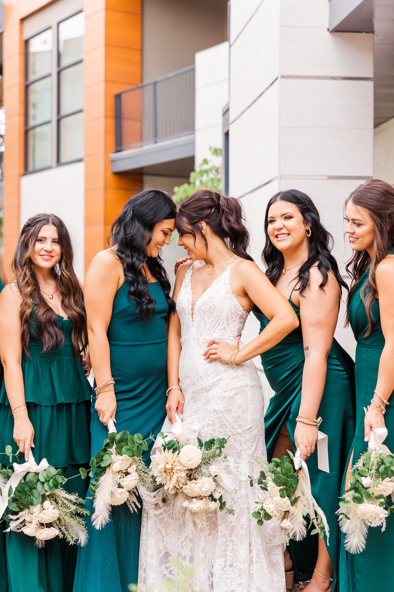 Bridemaids laughing with bride on her wedding day in Utah