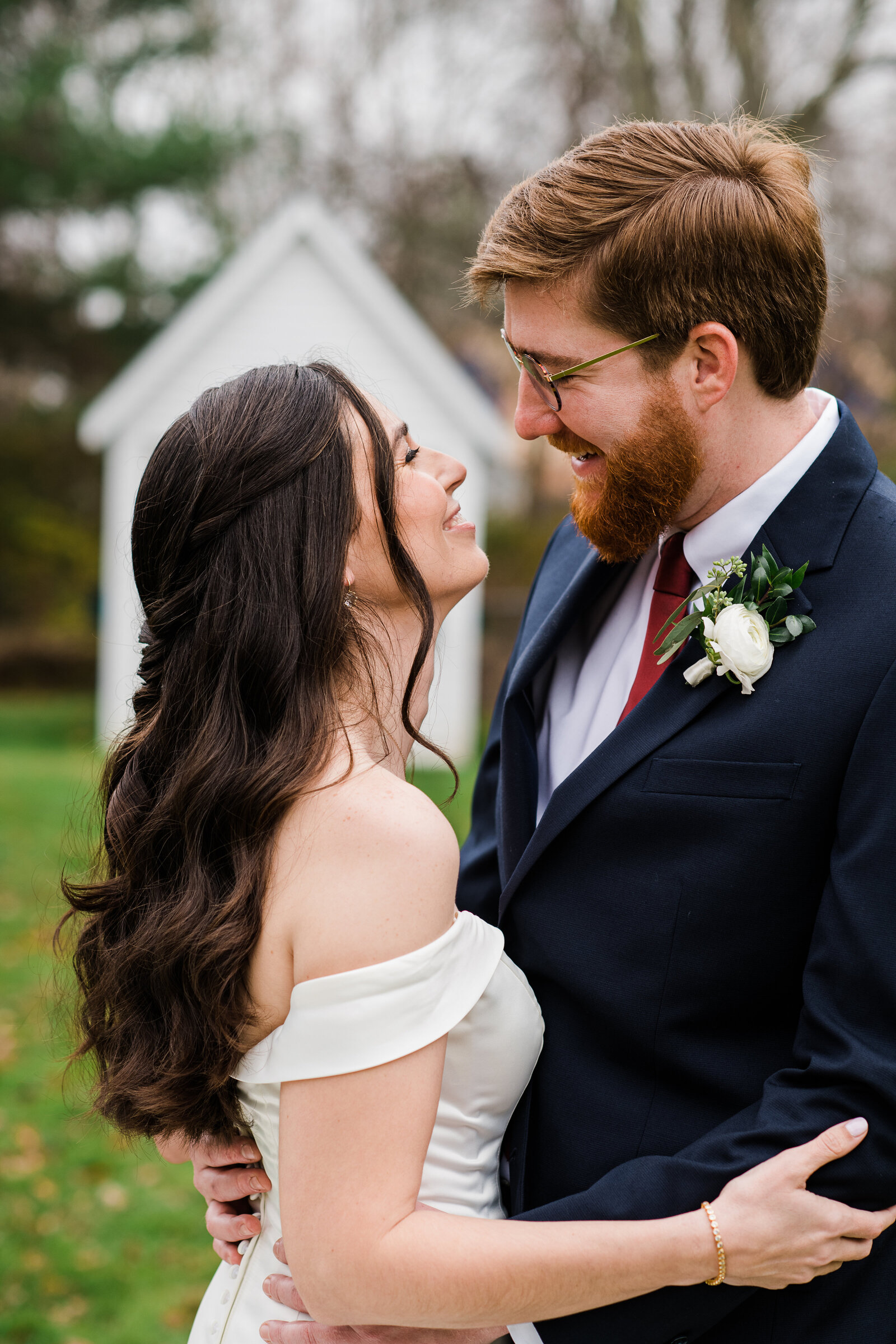 bride and groom face each other close up