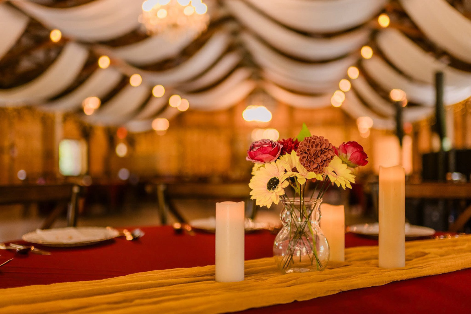 Long table designed with flowers and candles