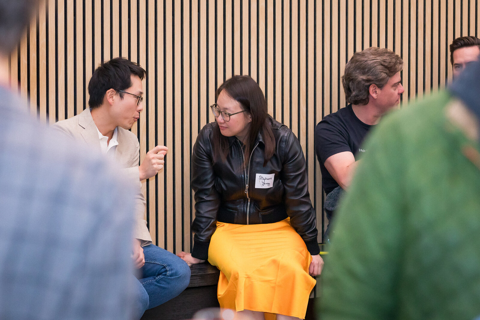 Small group conversations unfolding during the Holy Shift speaker event.