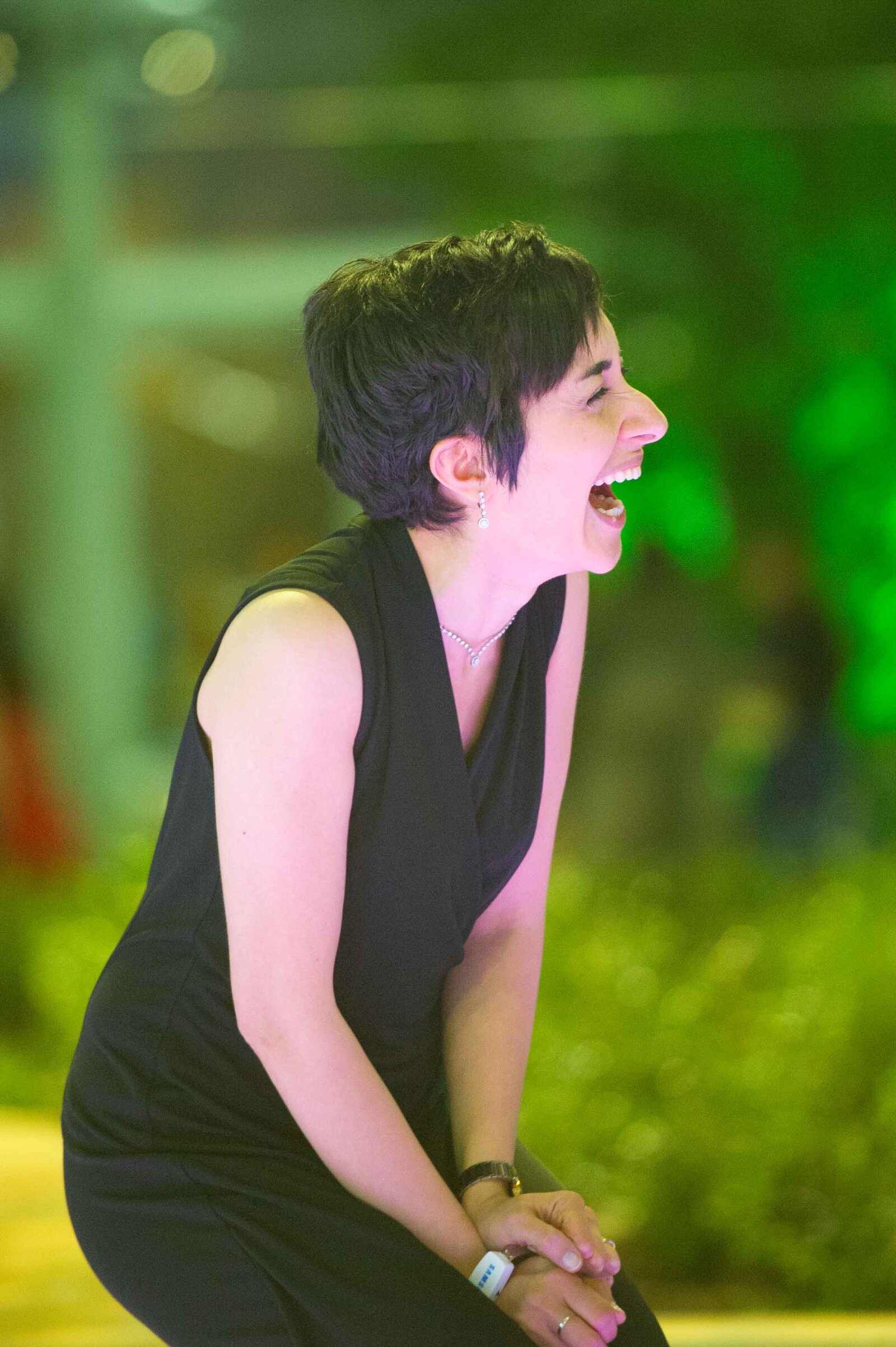 Holiday party women laughing.-