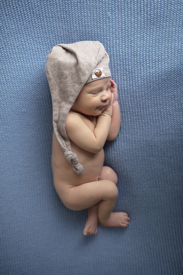 Newborn on blue, a Dallas newborn photographer.