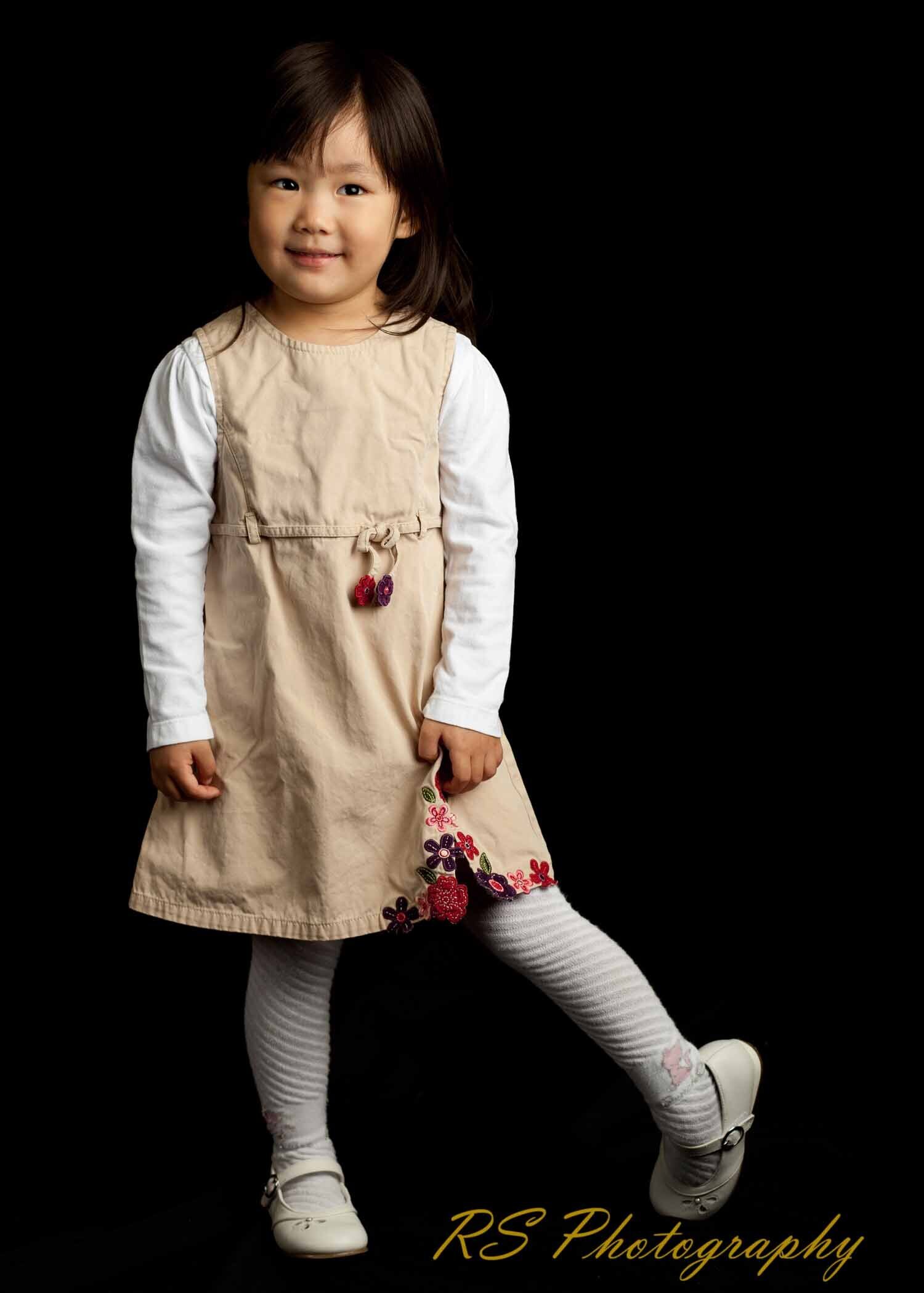 Young girl posing in a studio shoot with Ron Schroll Photography in Charlotte, NC