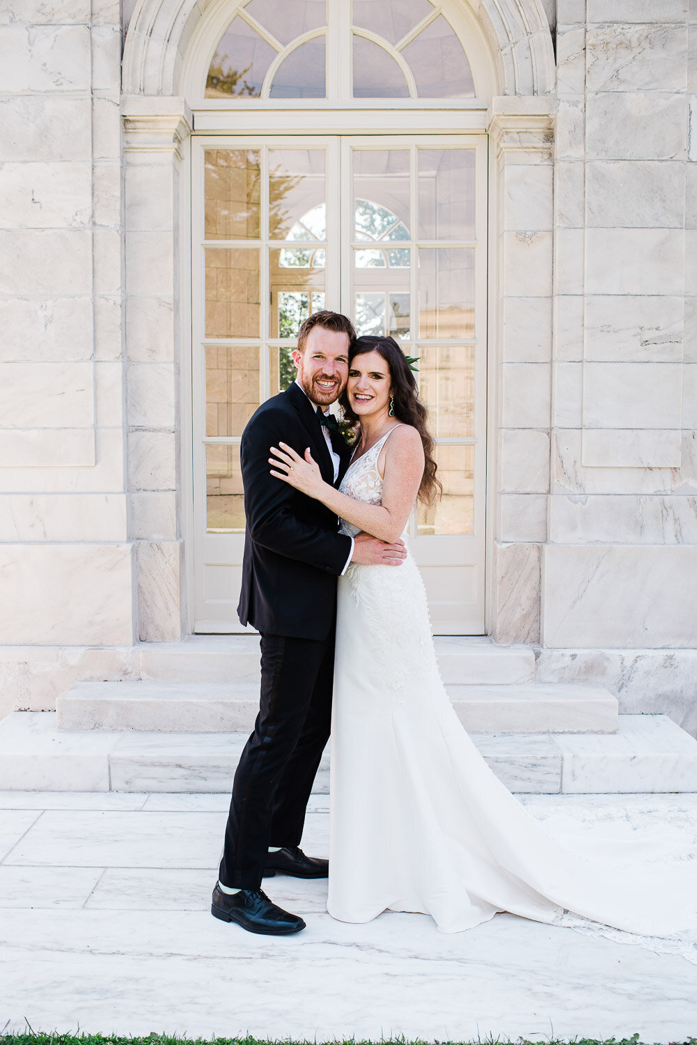 bride and groom full length portrait facing each other