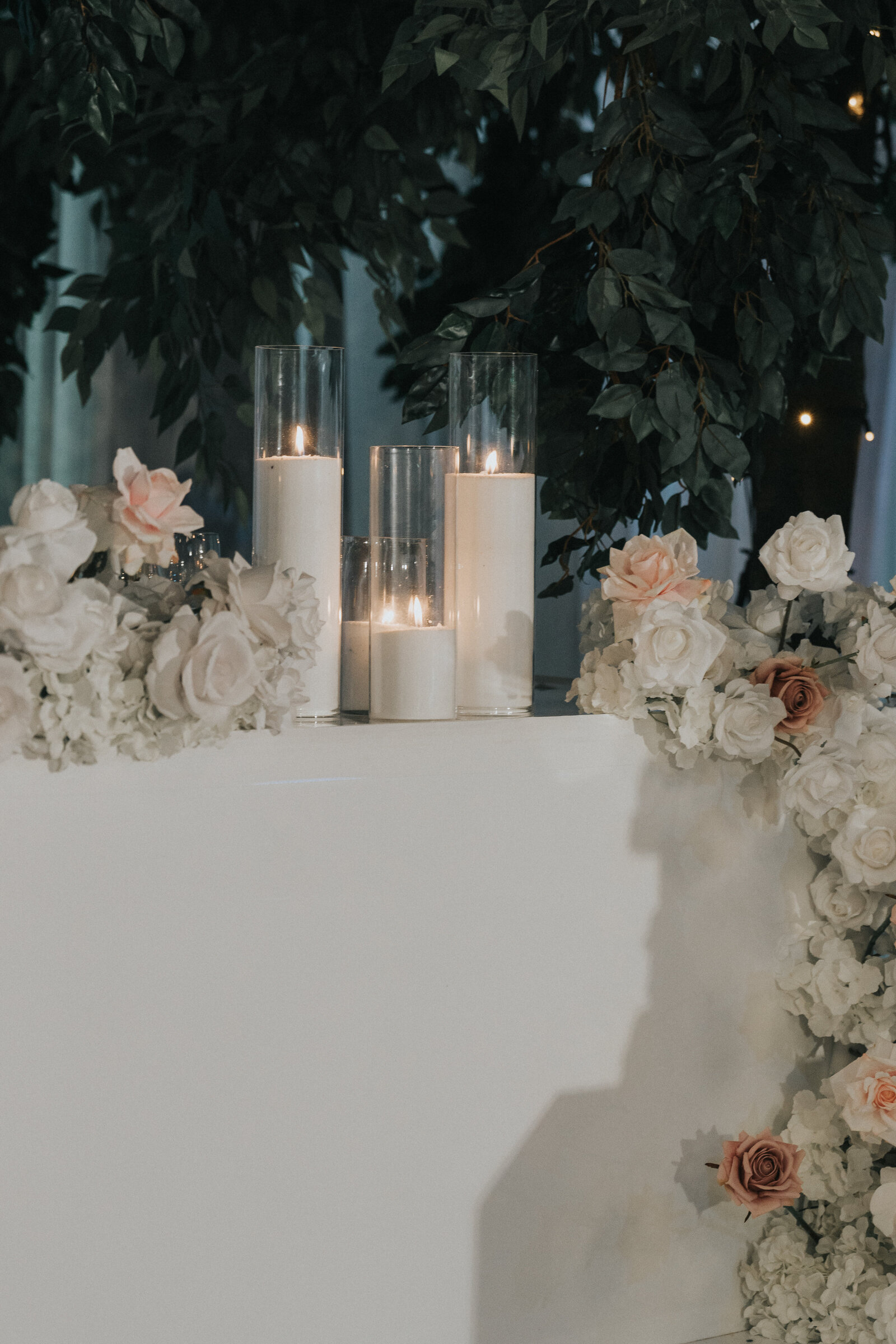 Whitestone wedding celebration beneath the floral ceiling