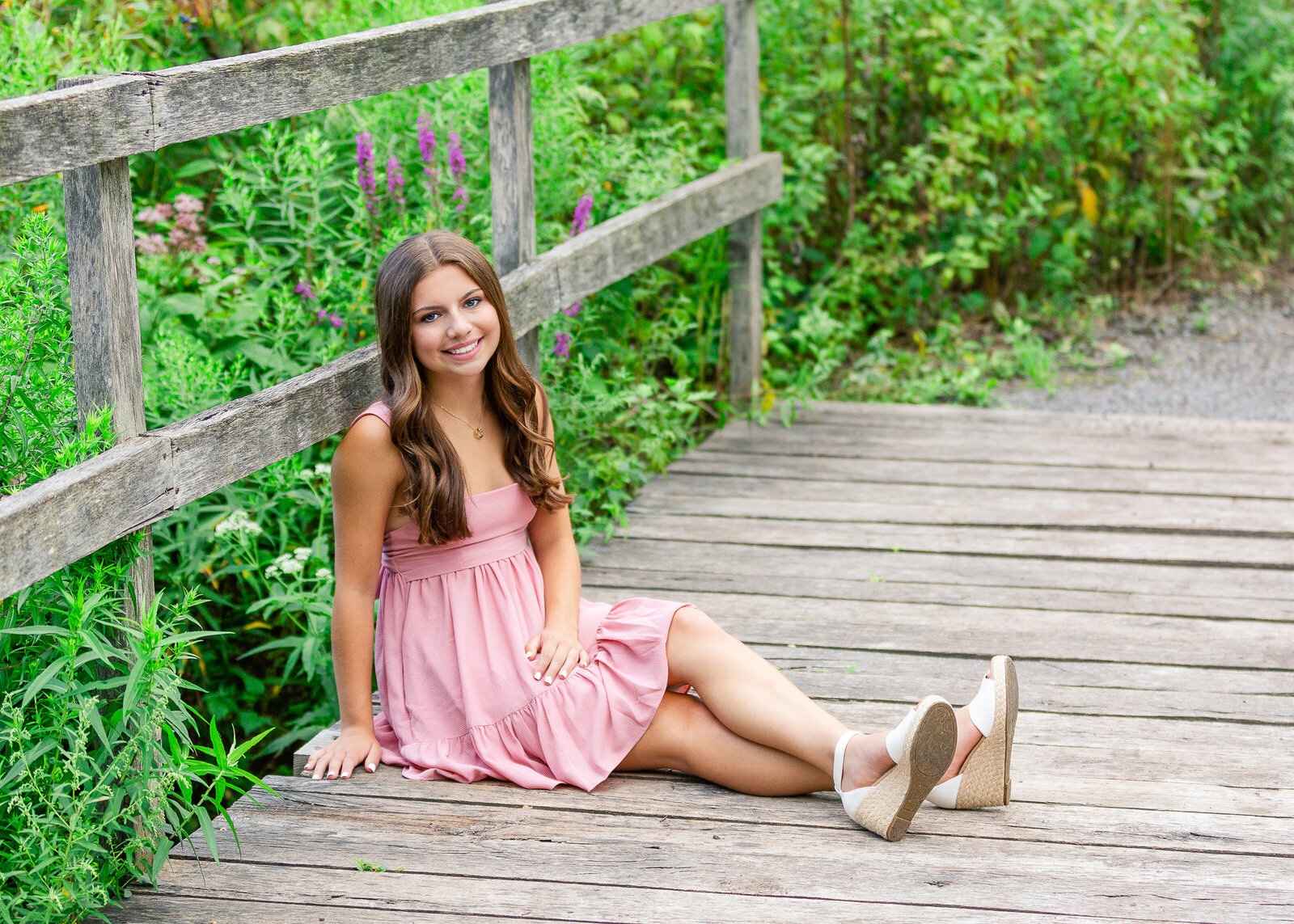 Pretty Senior pictures taken of a girl wearing a pink dress from Victor, NY07