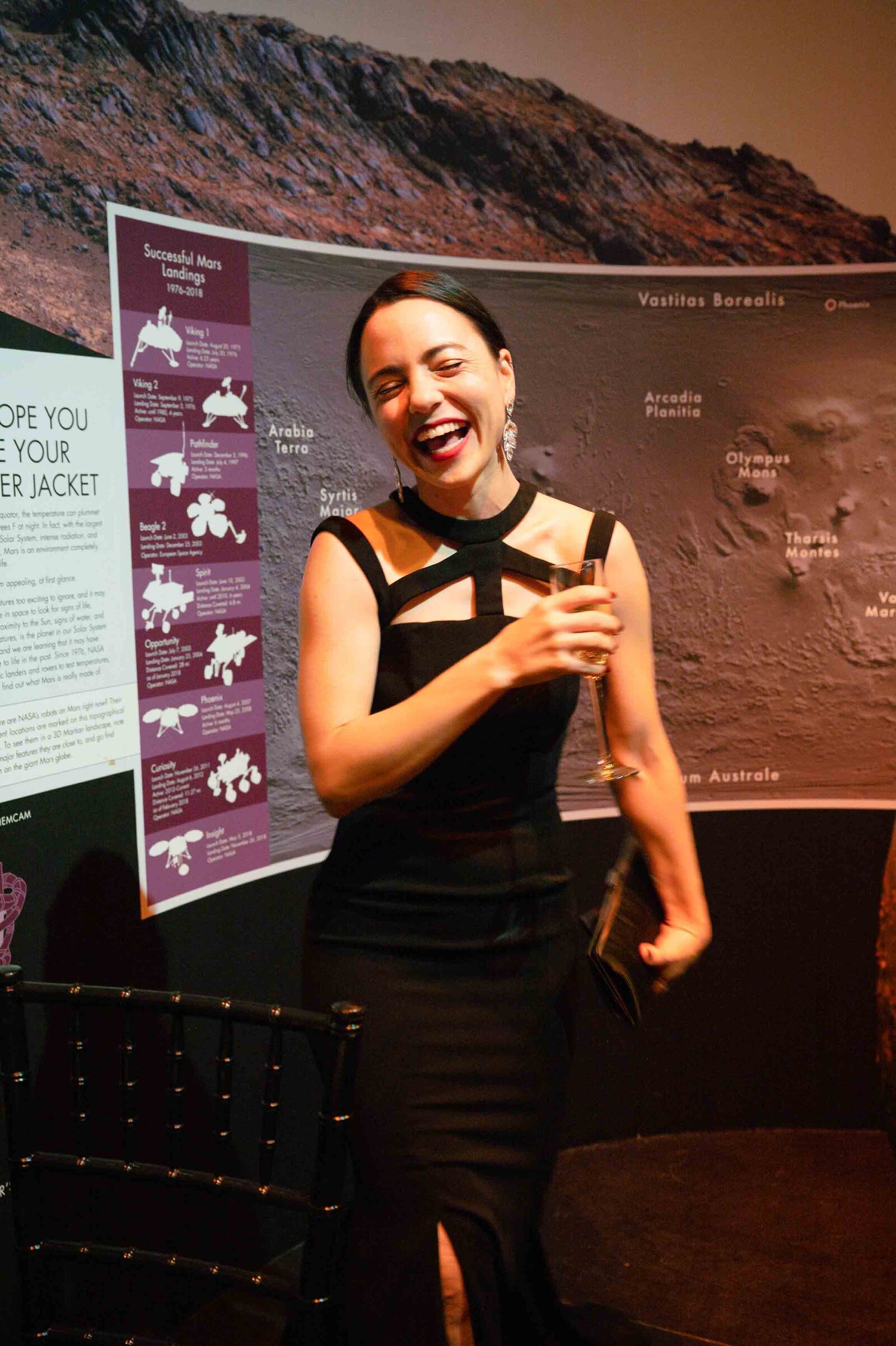 Holiday party woman laughing.-2021