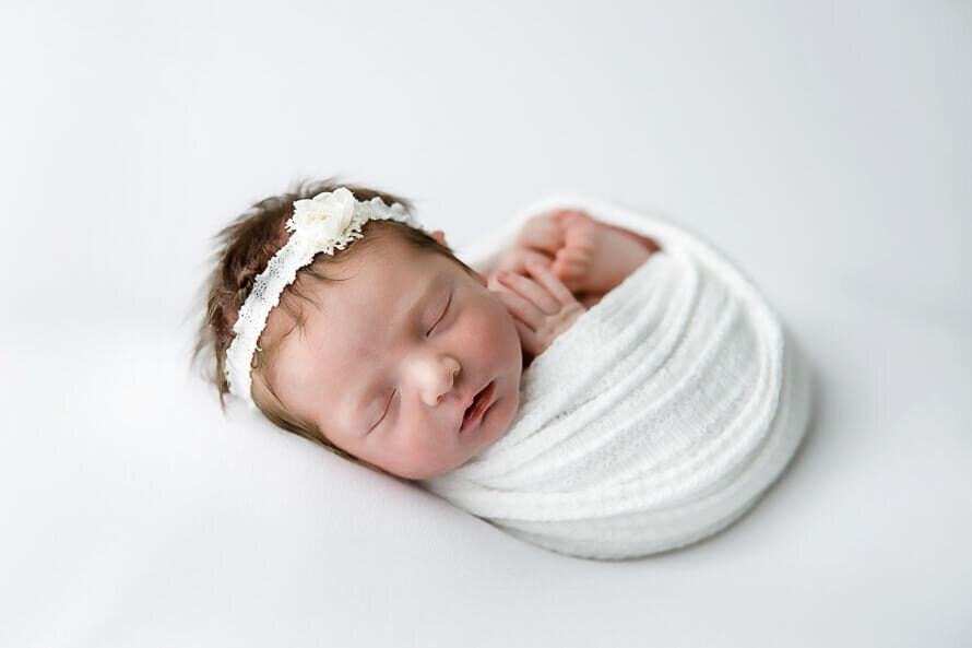 Newborn baby at Angela Marie Media.
