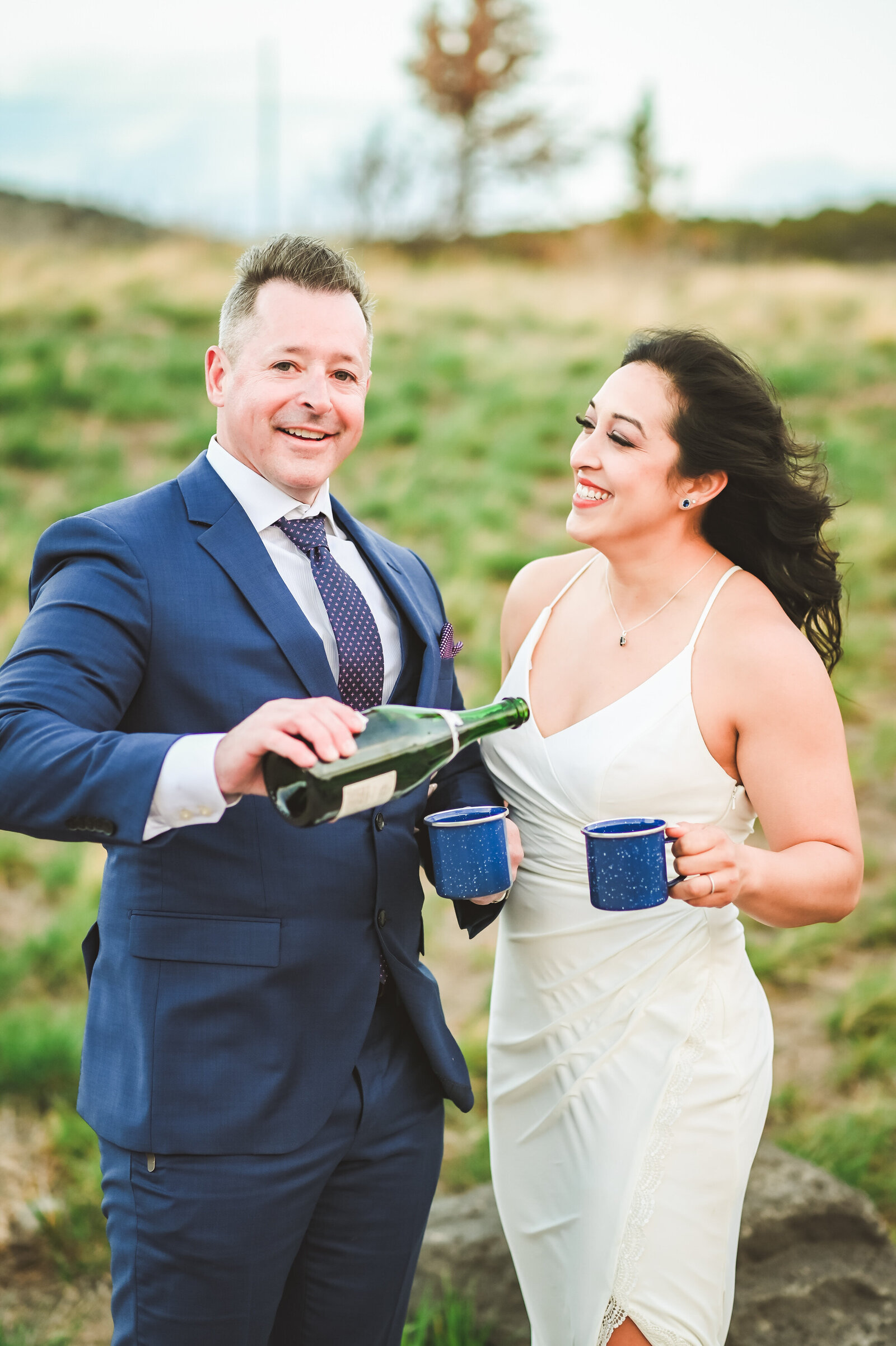 Jackson Hole videographer captures couple celebrating recent Jackson Hole elopement with champagne pop