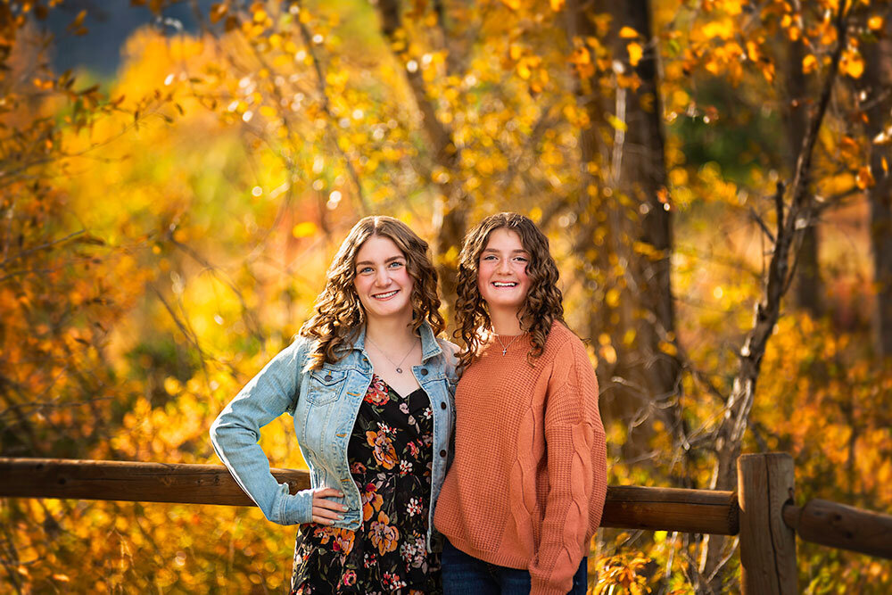 beautiful-natural-relaxed-two-teenage-girls-sisters-fall-folliage-orange-yellow-jewel-tones-rich-colors-colorado-boulder-south-mesa-trailhead-family-pictures