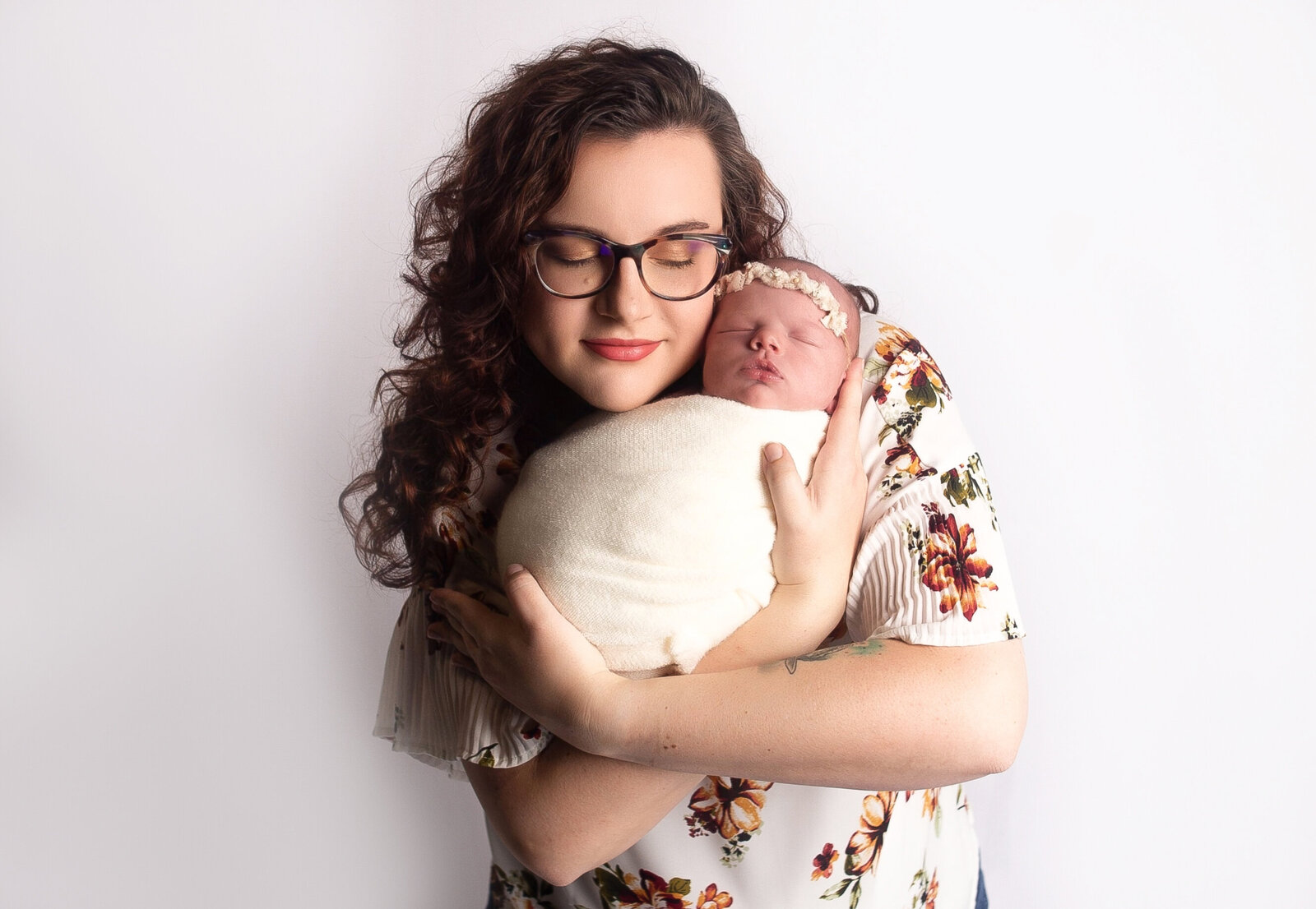 Mom snuggling baby during newborn photos with Nashville, TN photographer in Nashville, Tn Photography studio