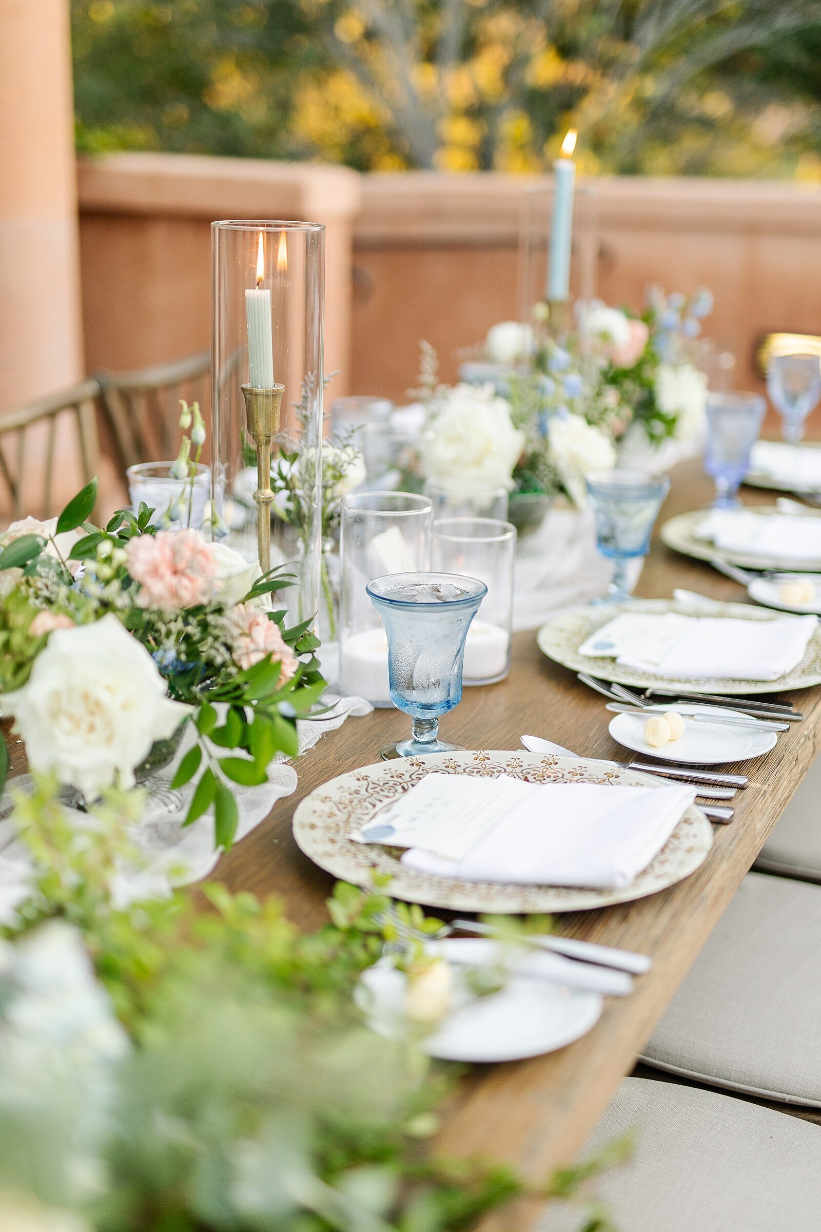 Wedding reception place settings photo by Bree Sherr of Sherr Weddings.