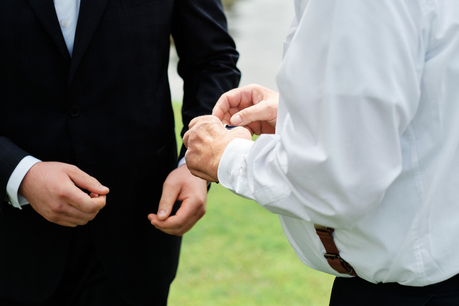 Best man removes the rings.